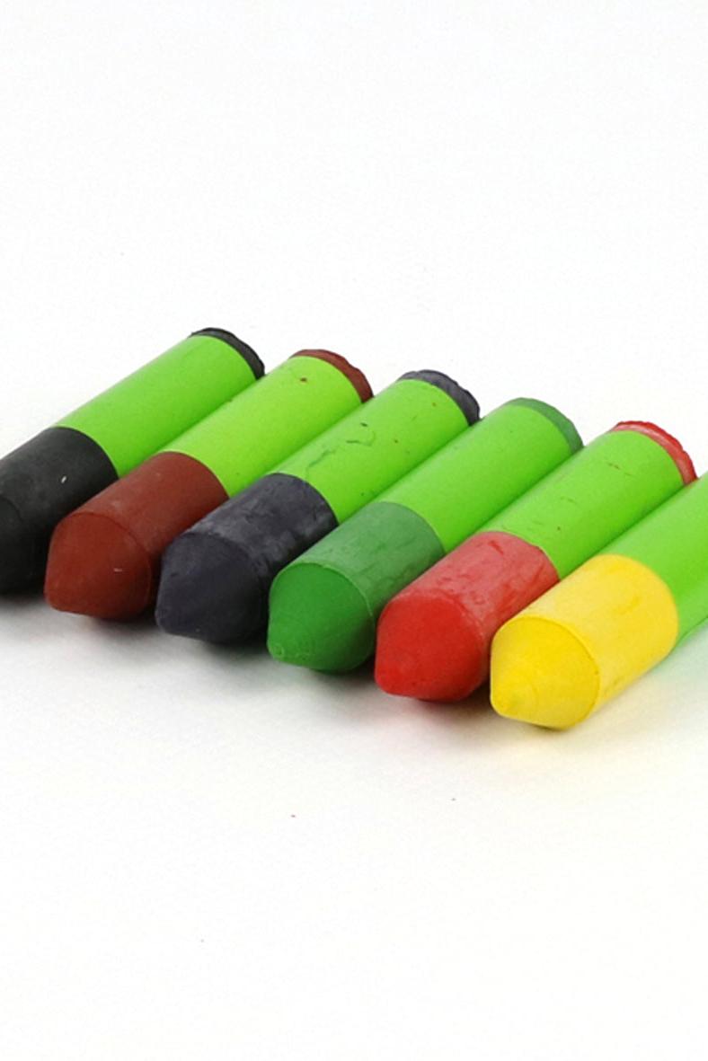 Set of colorful mini crayons on a white background