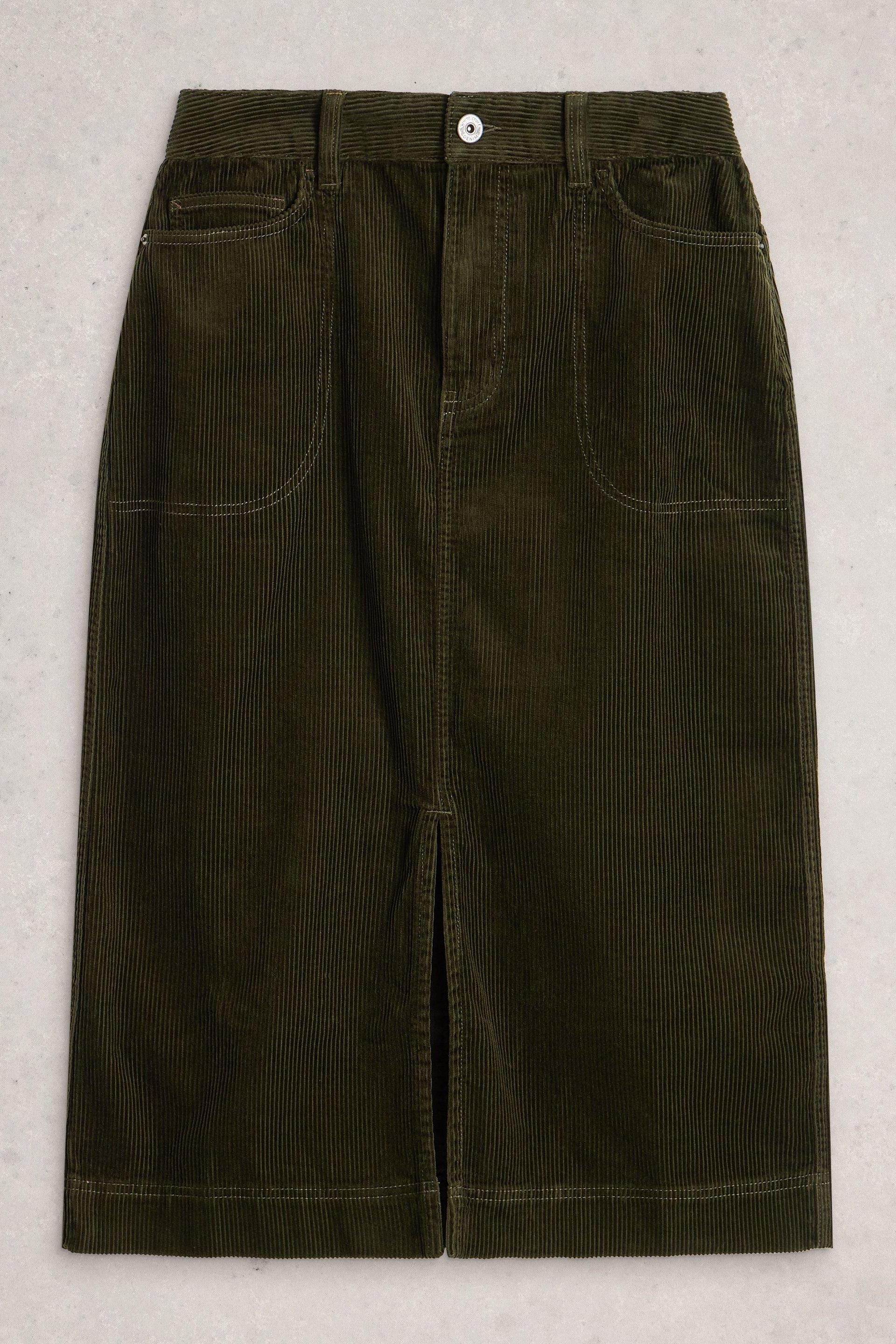 An olive green corduroy midi skirt with a front slit and deep pockets isolated on a light background.
