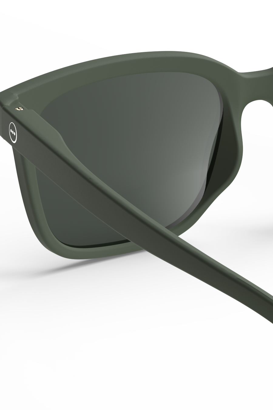 Close-up of olive green Izipizi sunglasses with a matte frame finish on a white background.
