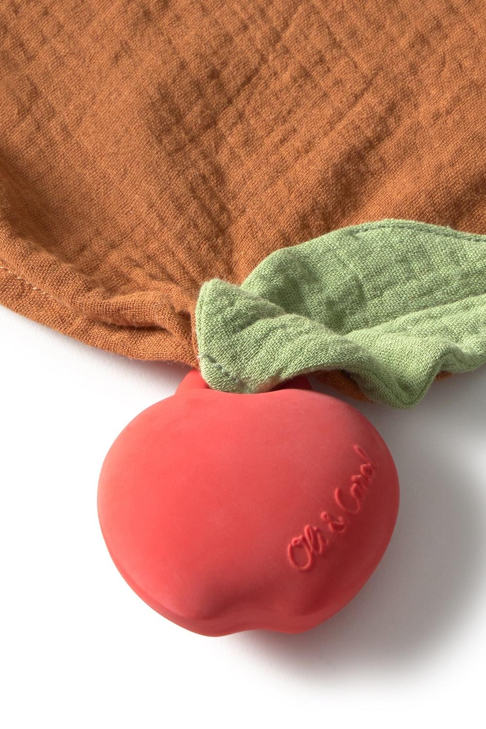 Red 100% natural rubber doudou with 'Oli & Carol' branding on a white background