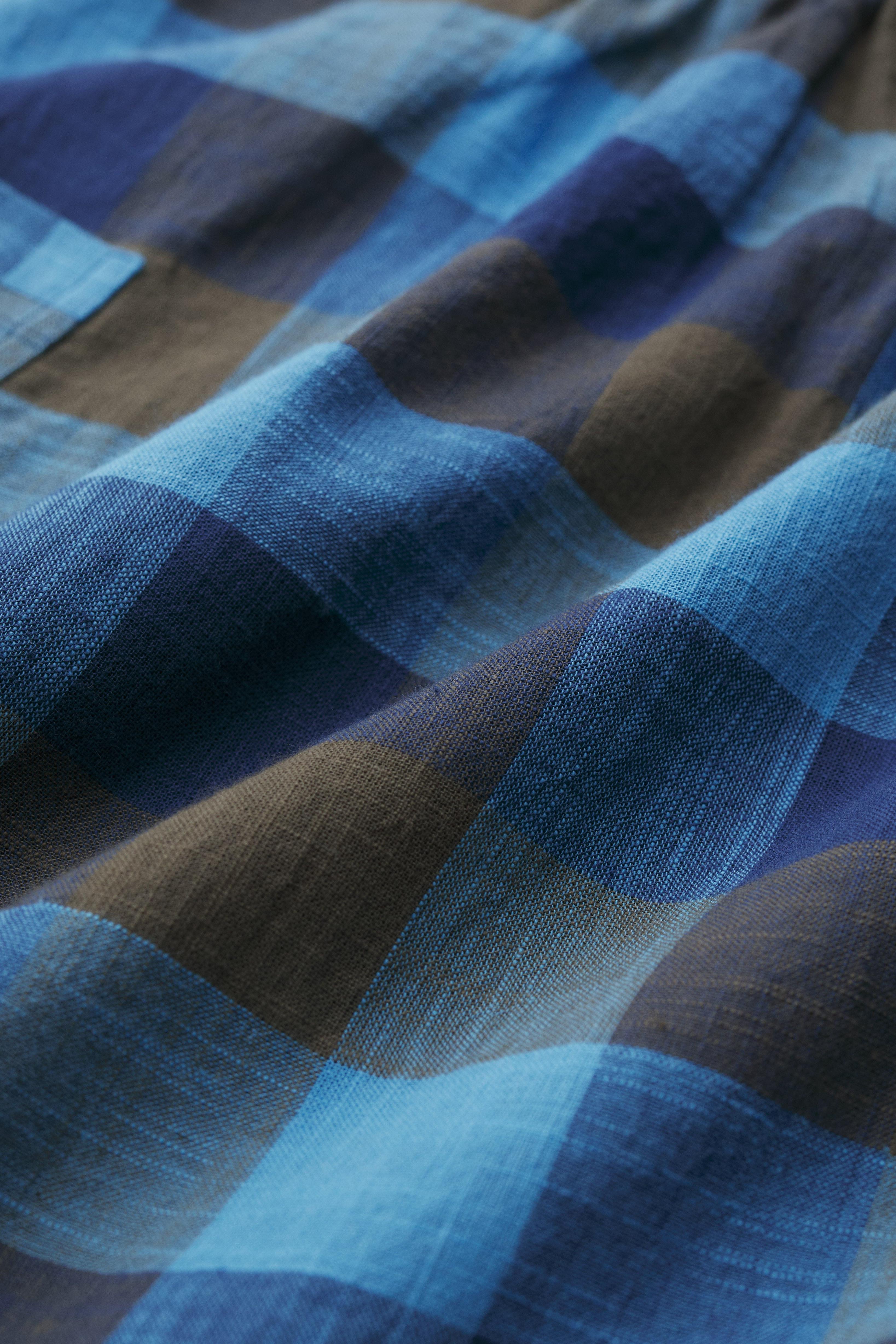 Close-up of blue and brown checkered organic cotton fabric