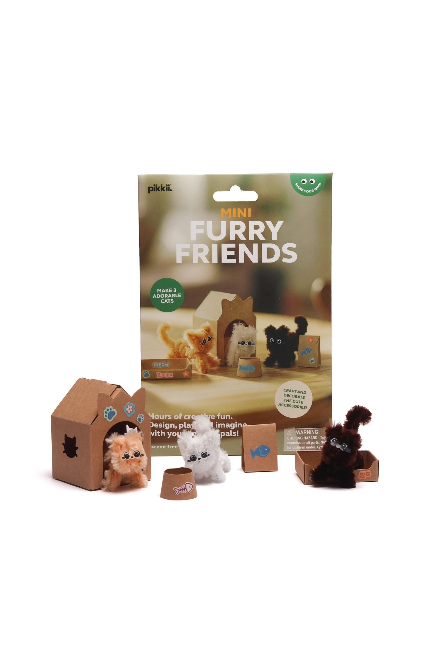 Pikkii Mini Furry Friends craft kit with three handmade fuzzy pipe-cleaner cats and cardboard accessories.