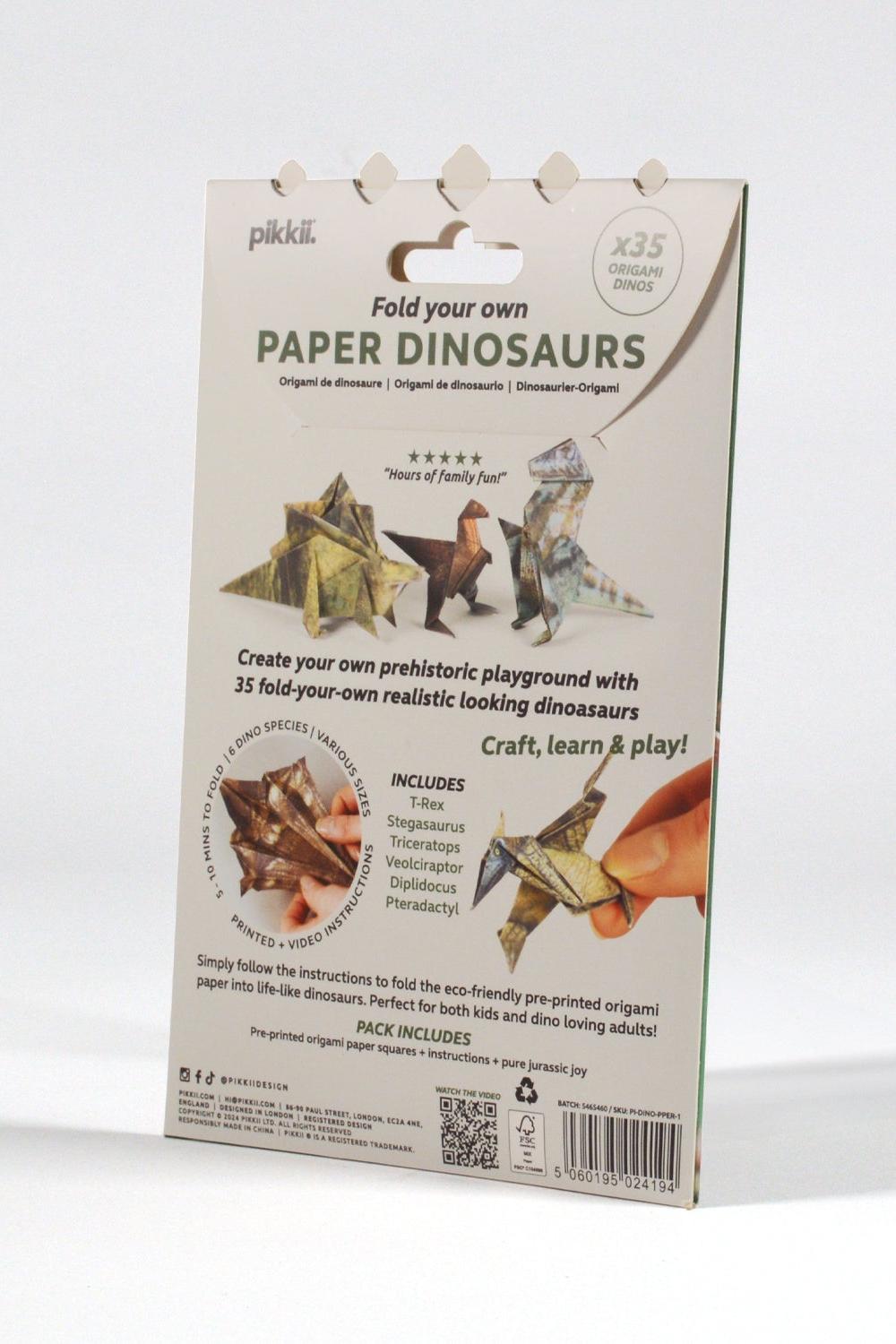 Packaging of paper dinosaurs with dinosaur illustrations on a white background