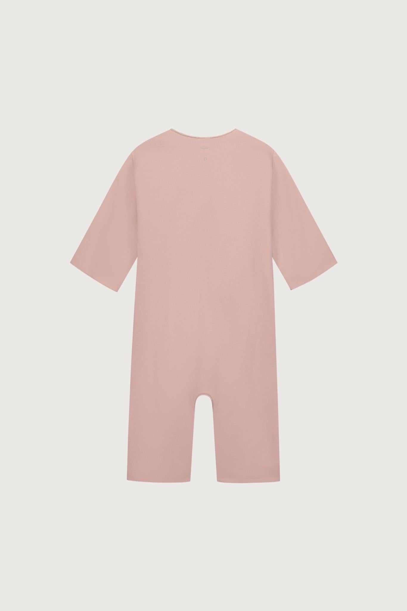 A dusty pink short-sleeve baby jumpsuit or romper shown flat against a light gray background.