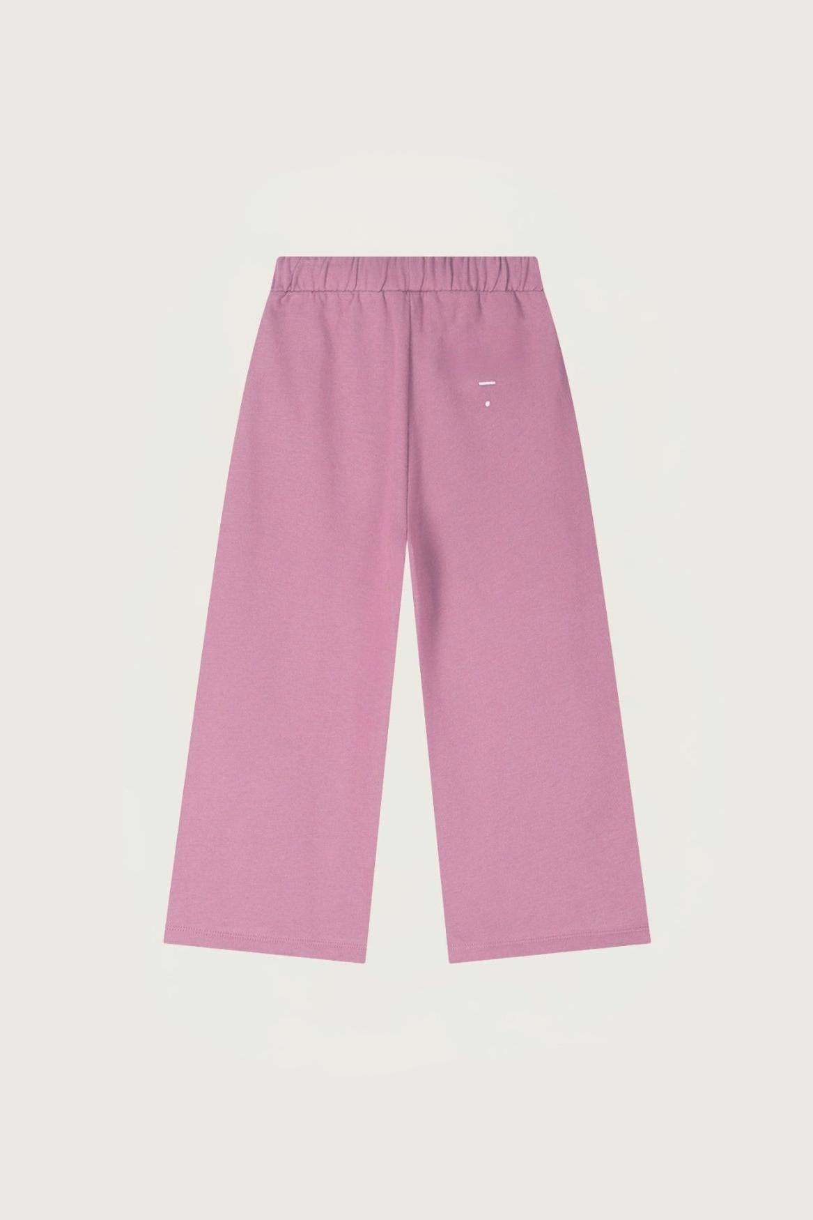 Pink organic cotton pants on a light gray background