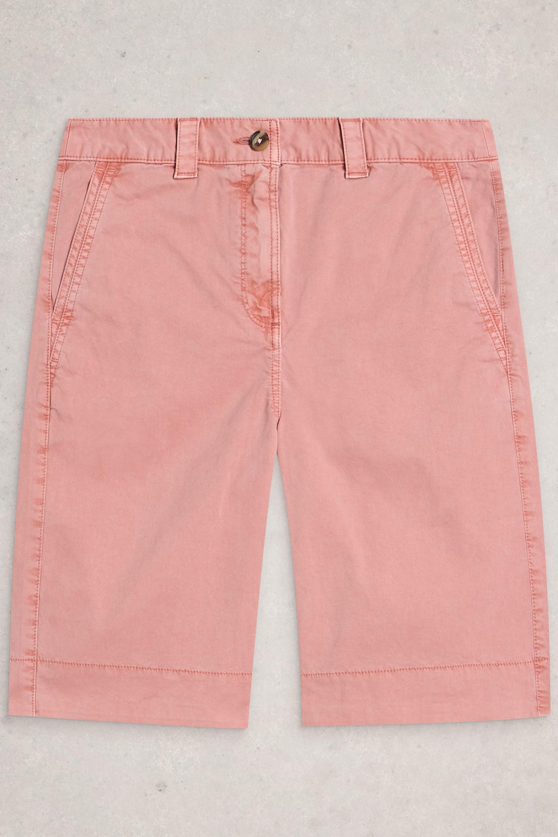 Pink organic cotton pants on a light gray background
