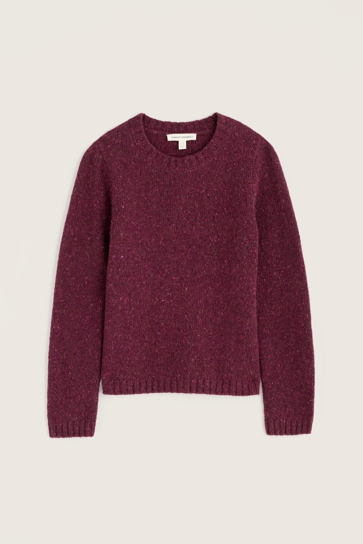A Seasalt Cornwall plum merino wool jumper against a neutral background.