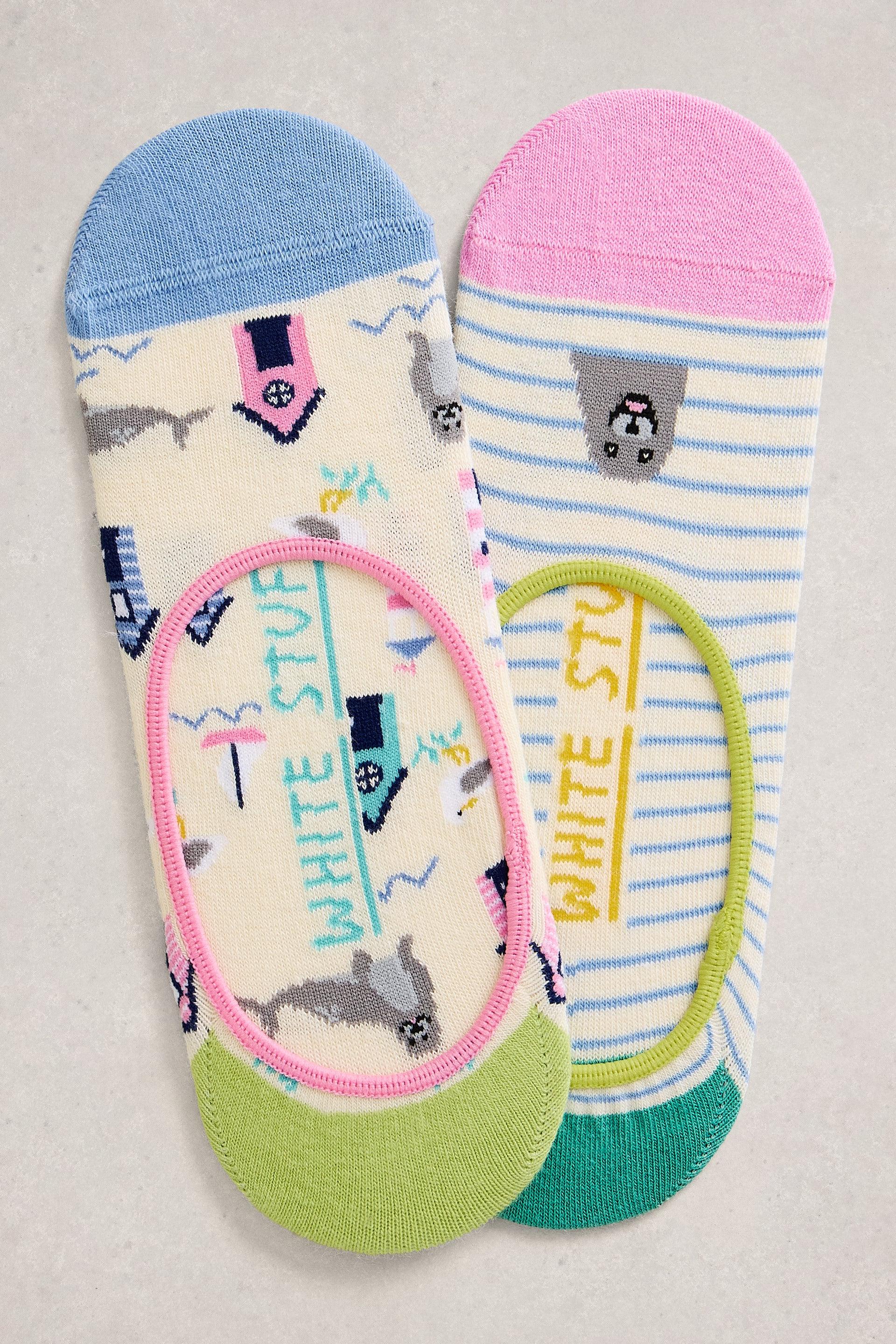 Two pairs of colorful socks with animal patterns on a neutral background