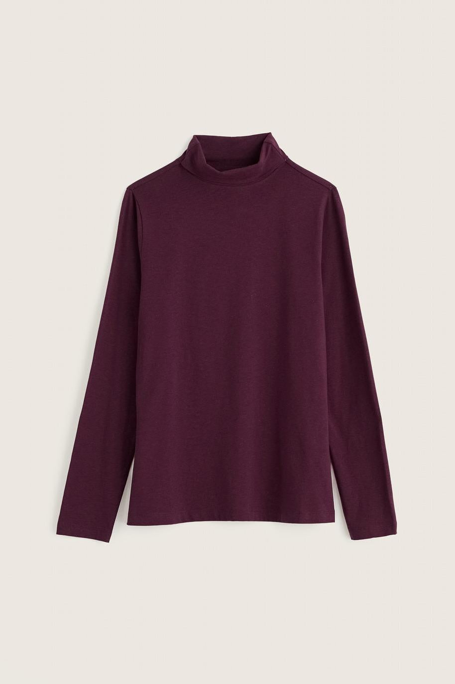 A deep purple organic cotton roll neck top for women against a neutral background.