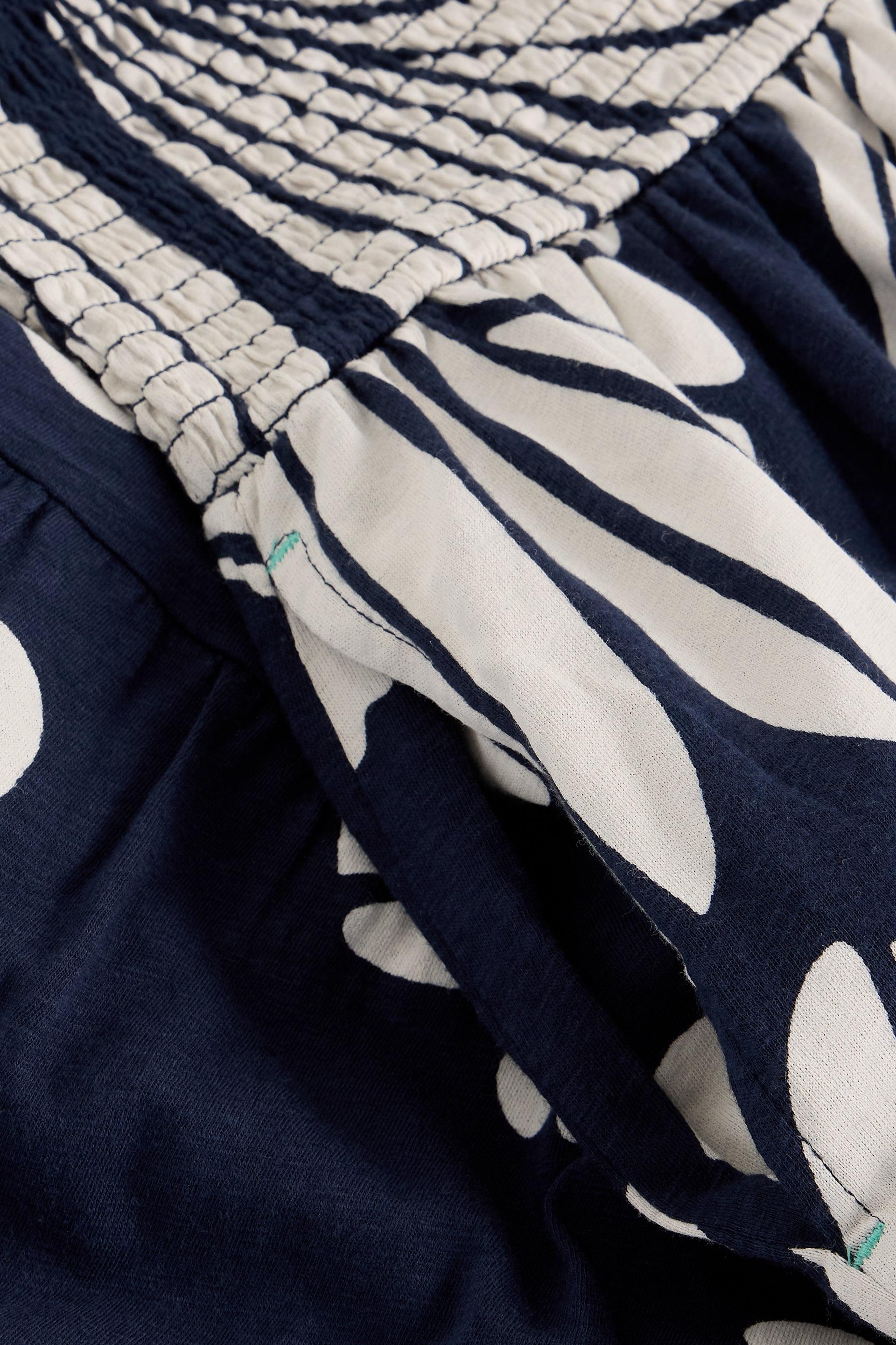 Navy blue skirt with white floral pattern and shirred detail