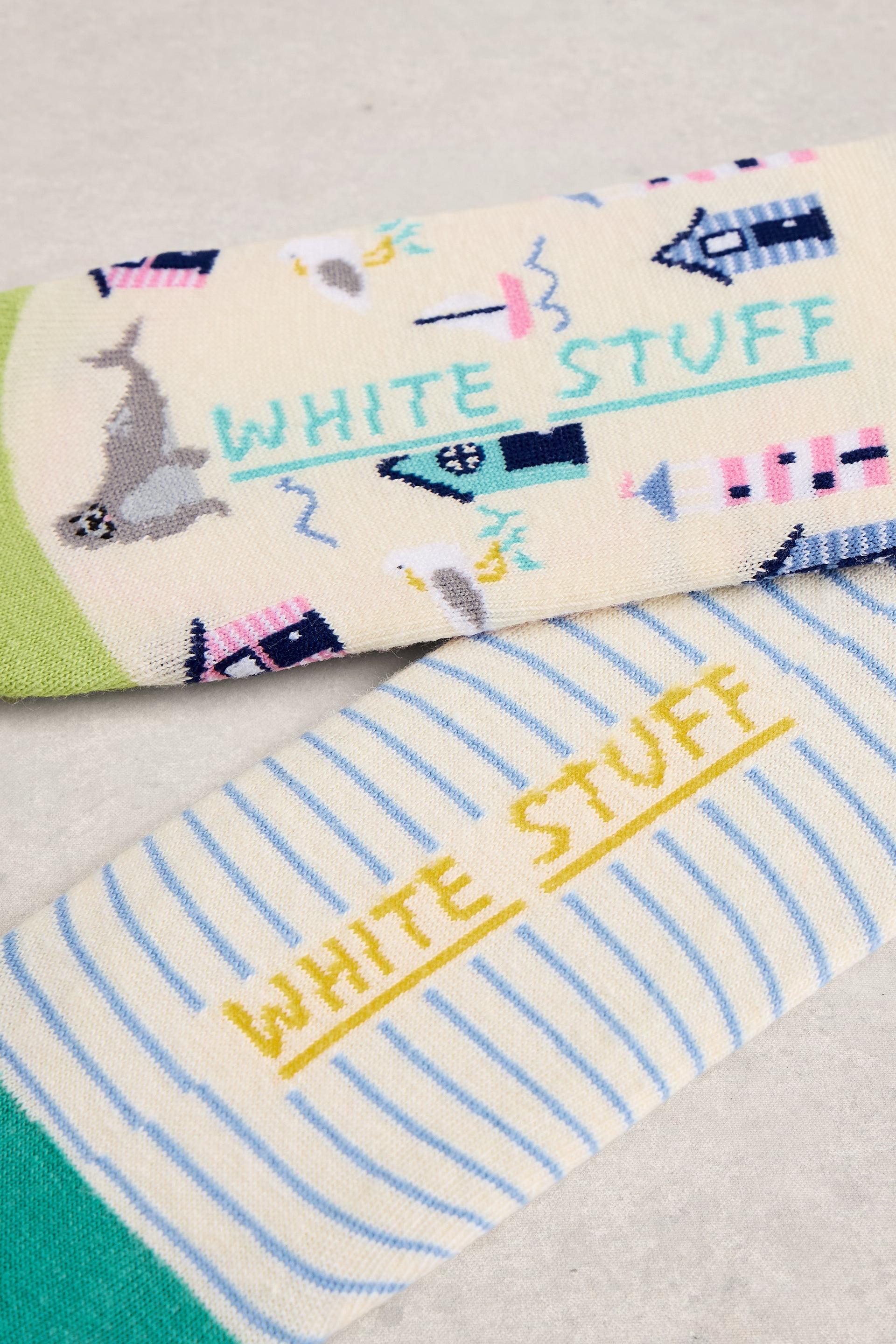 Two pairs of socks with 'White Stuff' branding on a neutral background
