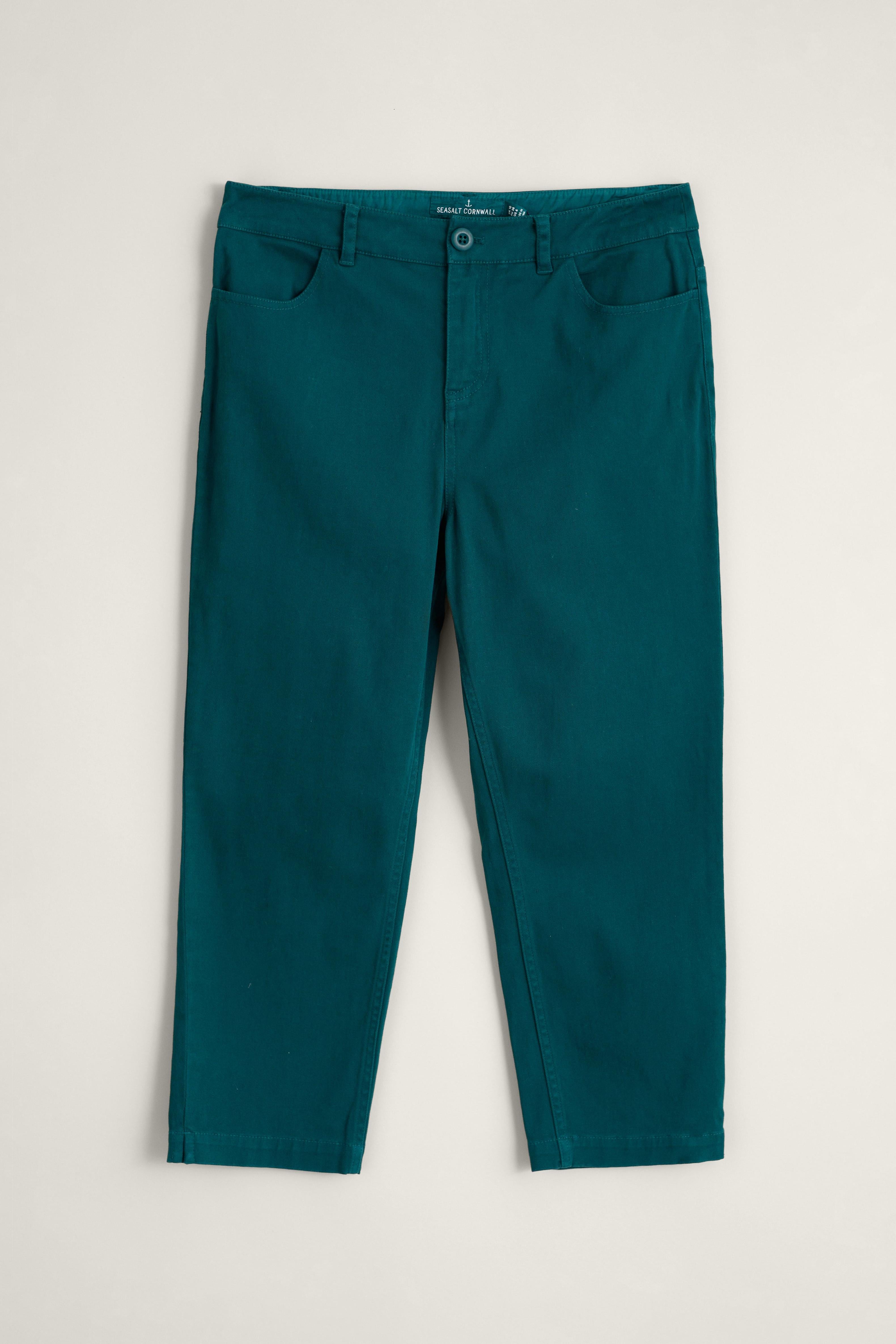 Teal organic cotton pants on a light gray background