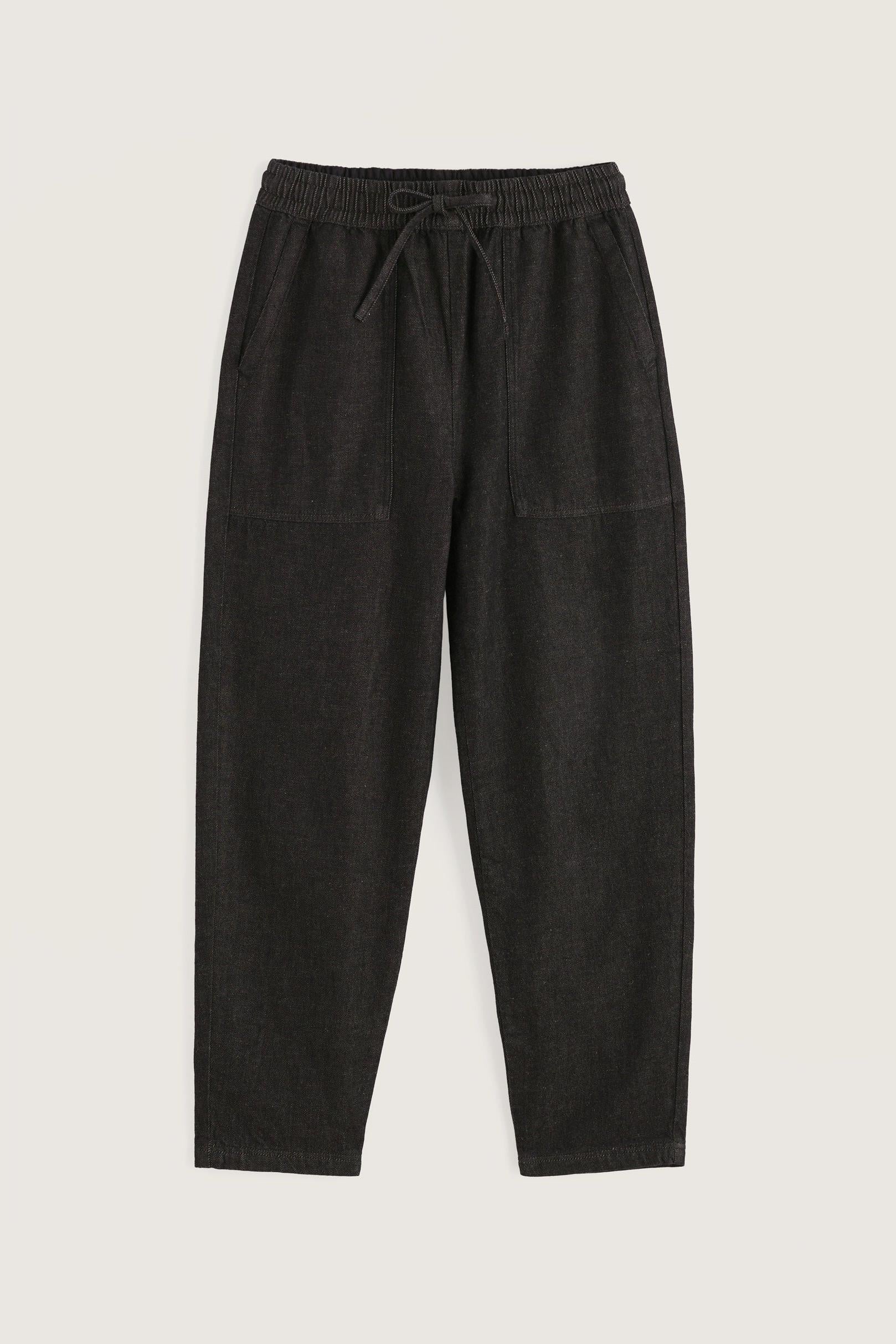 A pair of black organic cotton trousers by Seasalt Cornwall with an elasticated drawstring waistband.