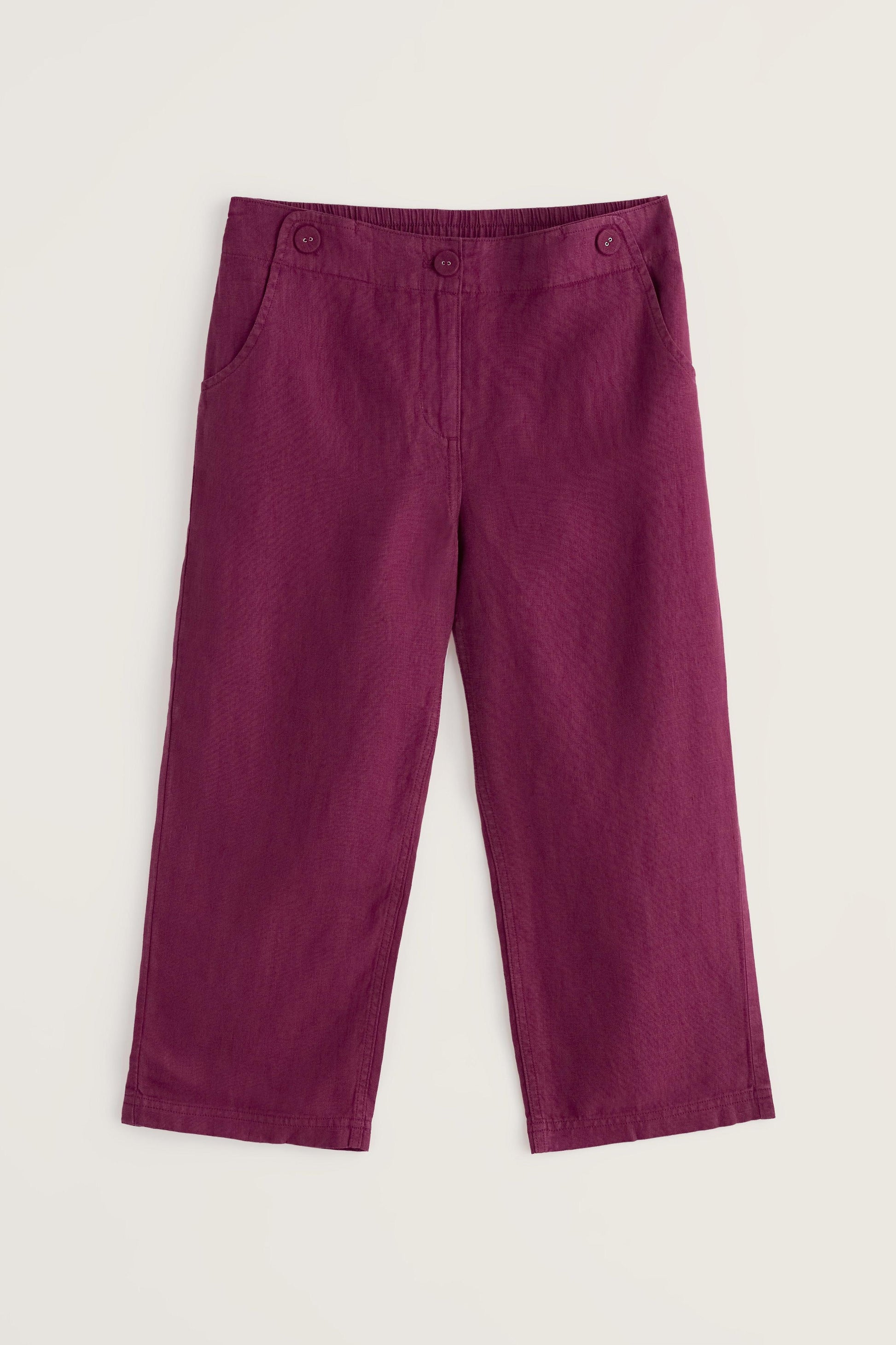 Purple cropped pants on a light beige background