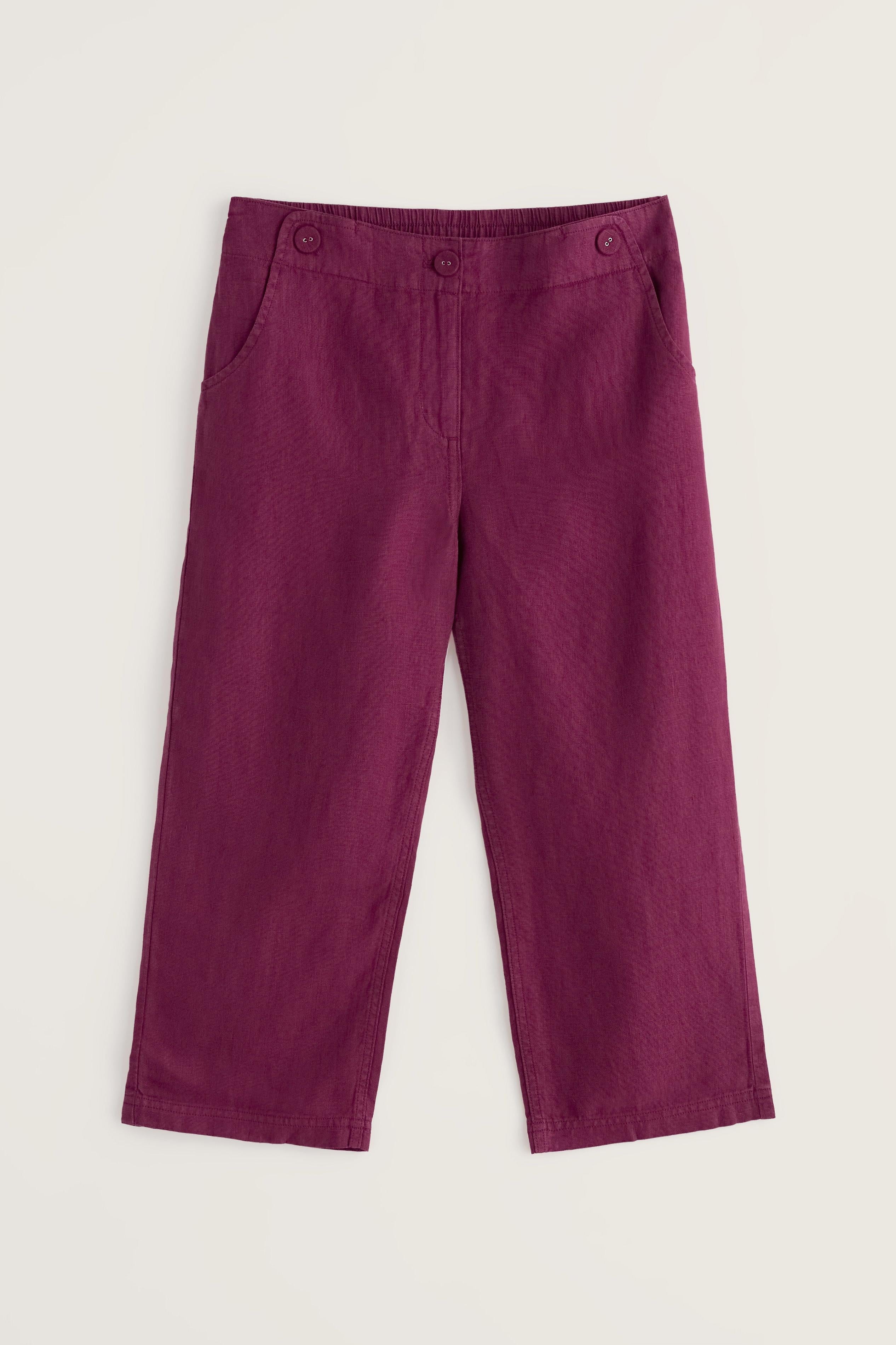 Purple cropped pants on a light beige background