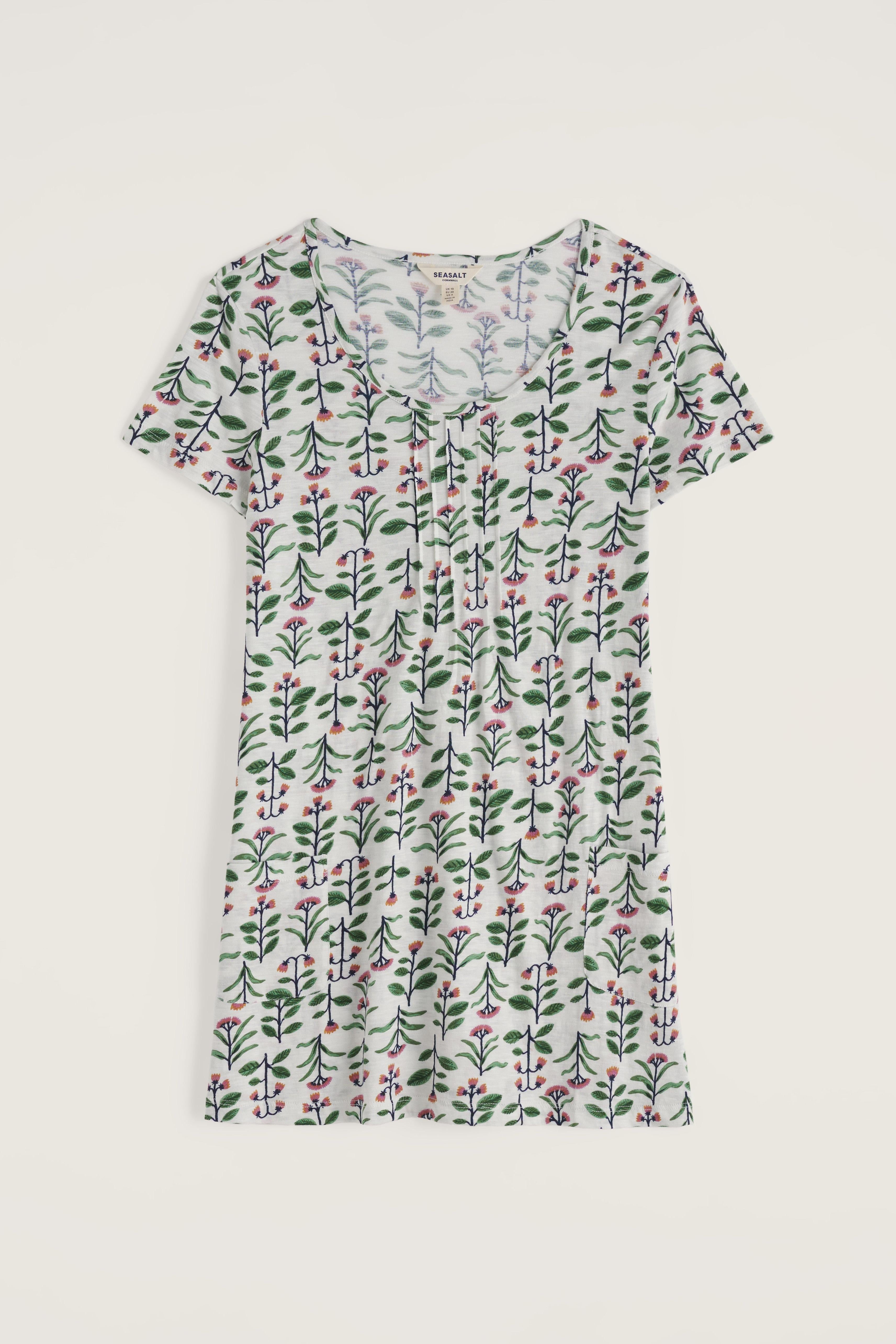 Floral patterned tunic on a light gray background