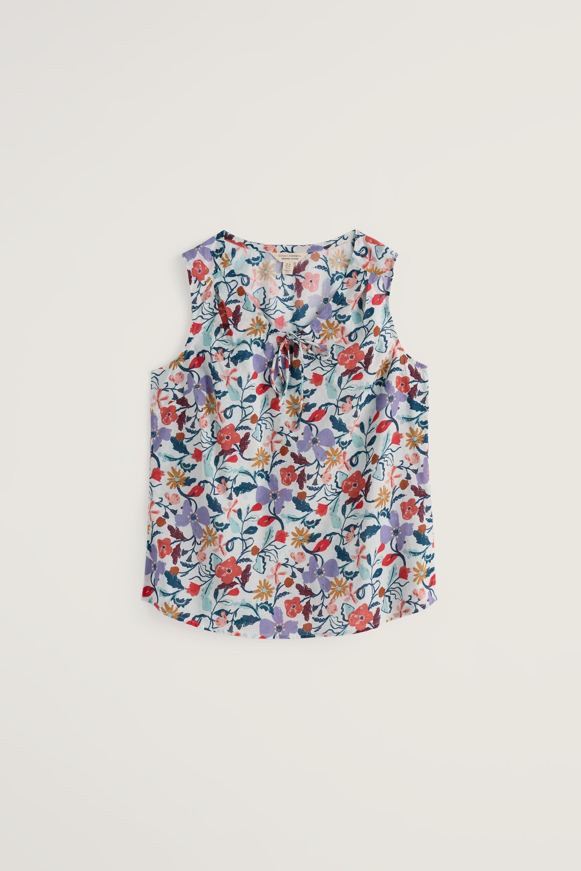 Floral sleeveless top on a light beige background