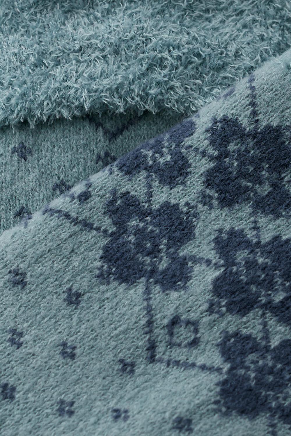 Close-up of Seasalt Cornwall blue fluffy winter socks with a floral pattern, ideal as a Christmas gift.