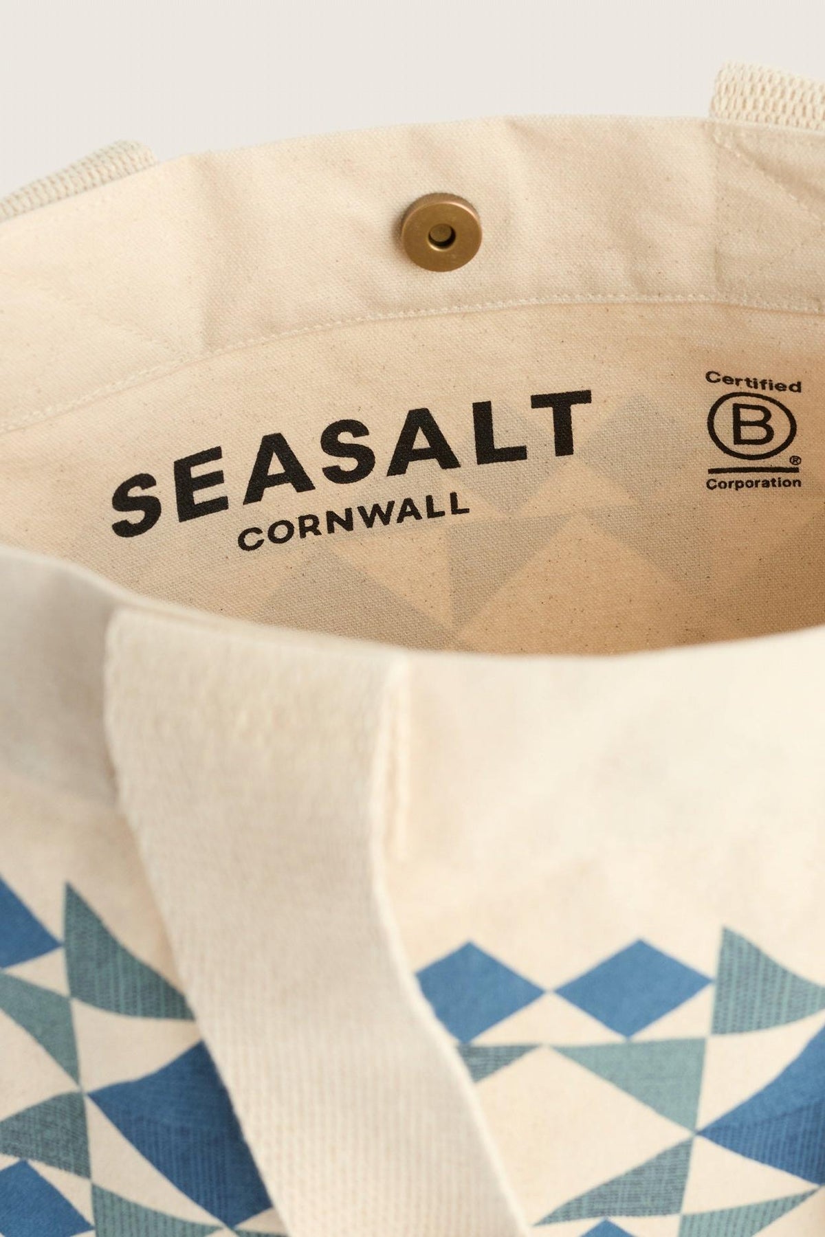 Interior of a Seasalt Cornwall canvas reusable shopping bag featuring the brand logo and B Corp certification.