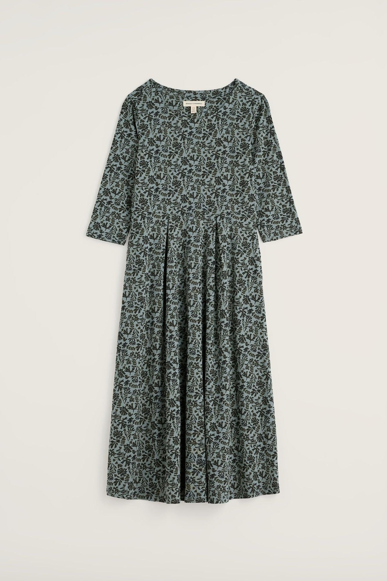 A dark green and black patterned midi dress with three-quarter sleeves, shown flat against a light beige background.