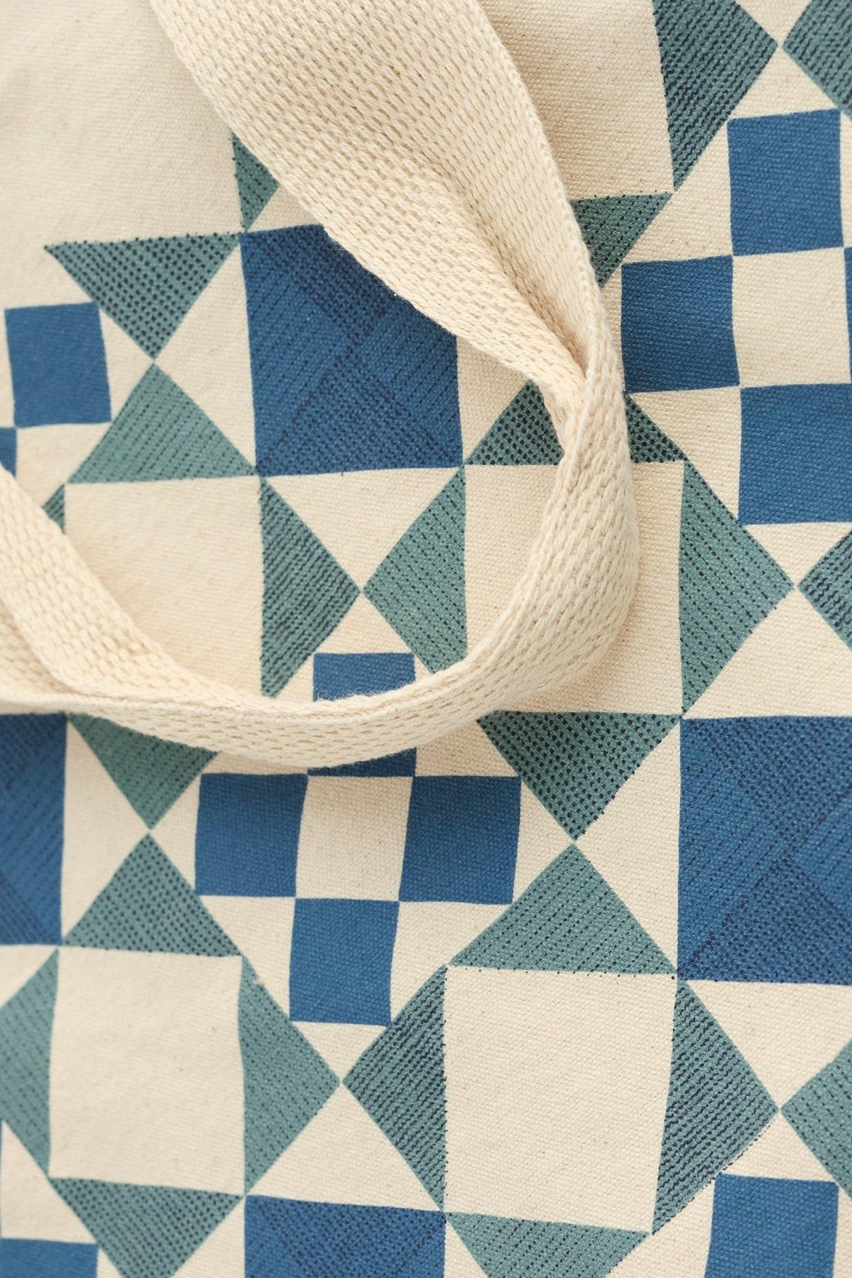 Seasalt Cornwall canvas shopping bag with blue and teal geometric quilt pattern.