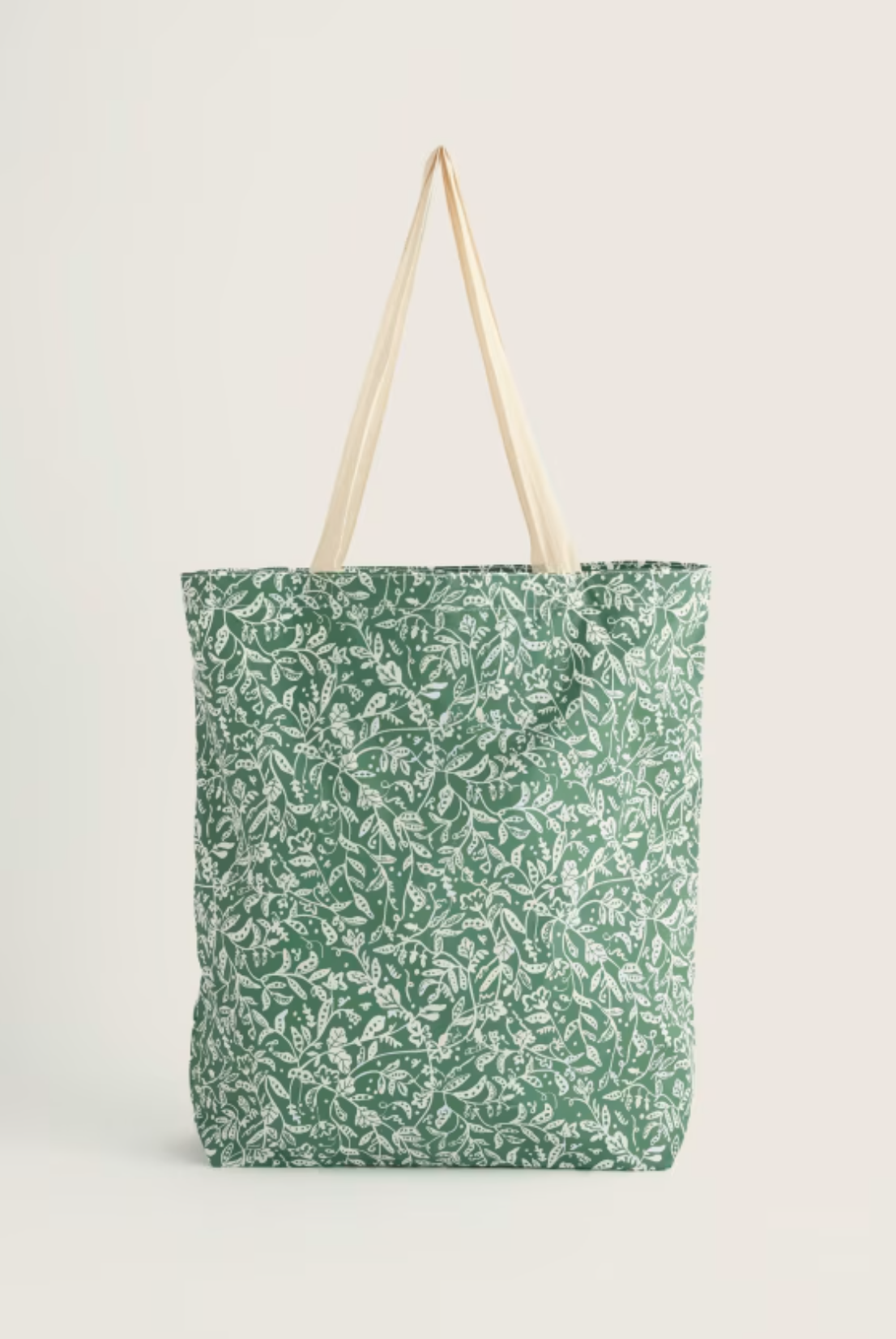 Seasalt Cornwall green cotton shopping bag with white floral botanical print pattern.