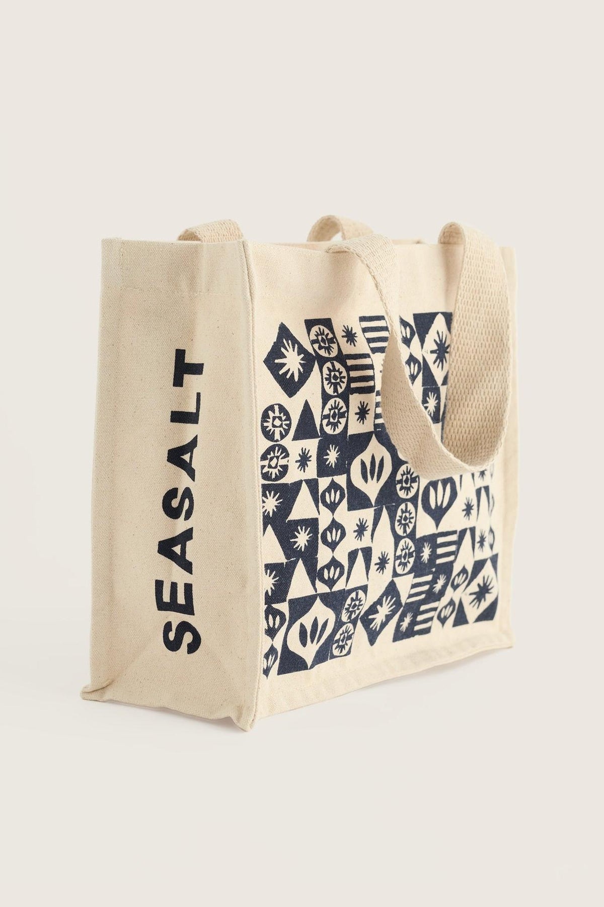 Seasalt Cornwall organic cotton canvas shopping bag with blue geometric pattern on a plain background.