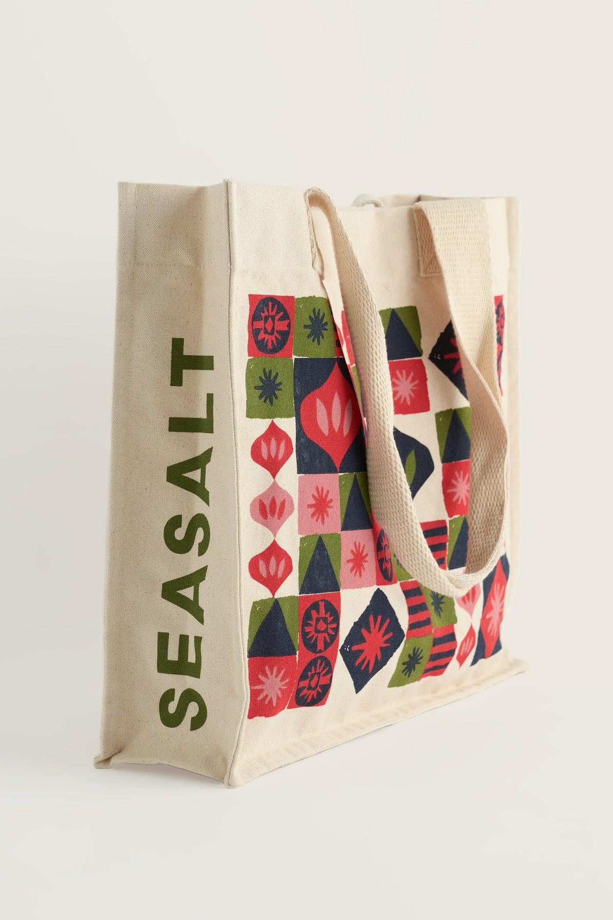 Seasalt Cornwall canvas shopping bag with a colorful geometric print on a plain white background.