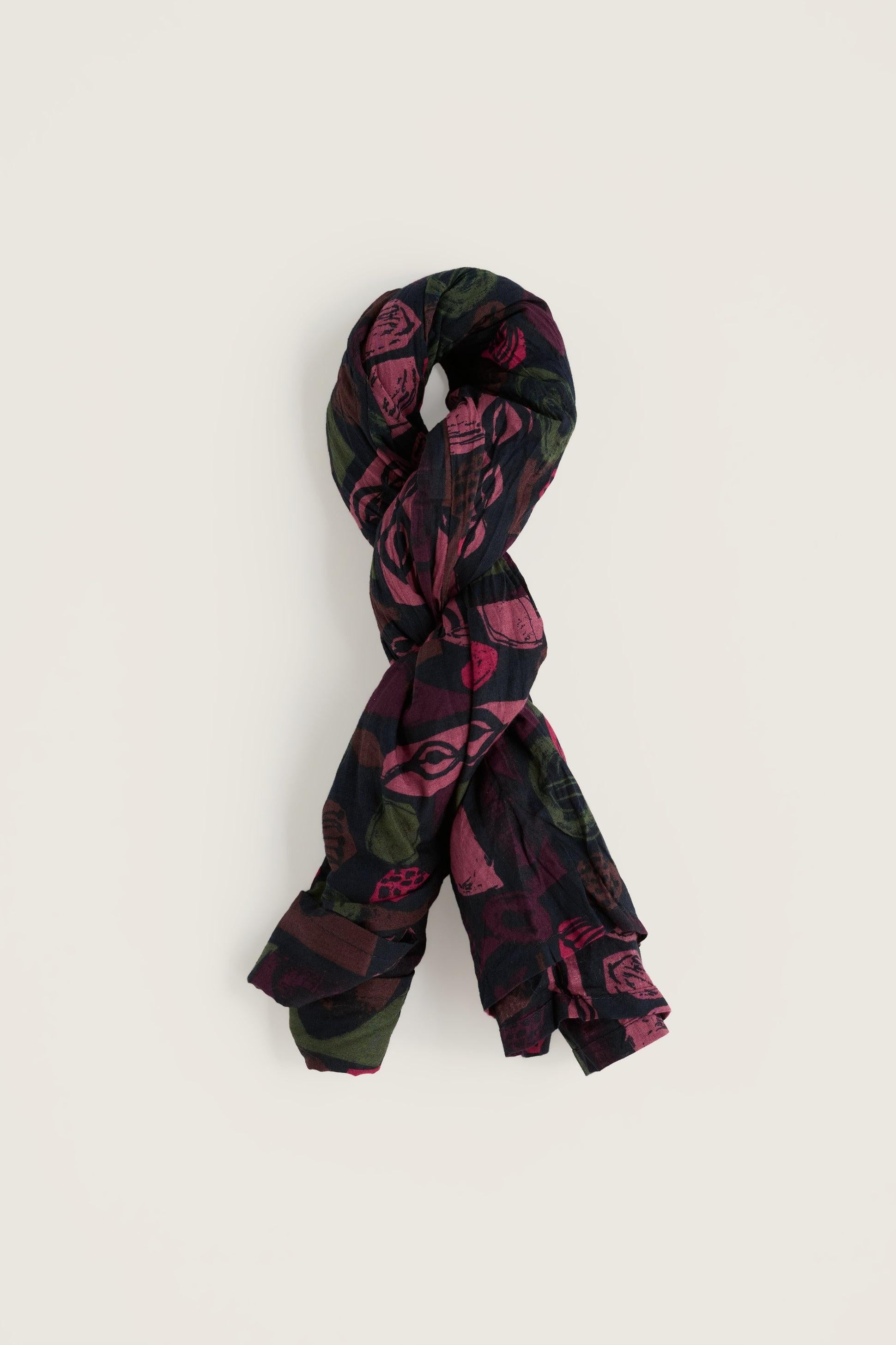 Seasalt Cornwall scarf with a dark floral and abstract pattern on an off-white background