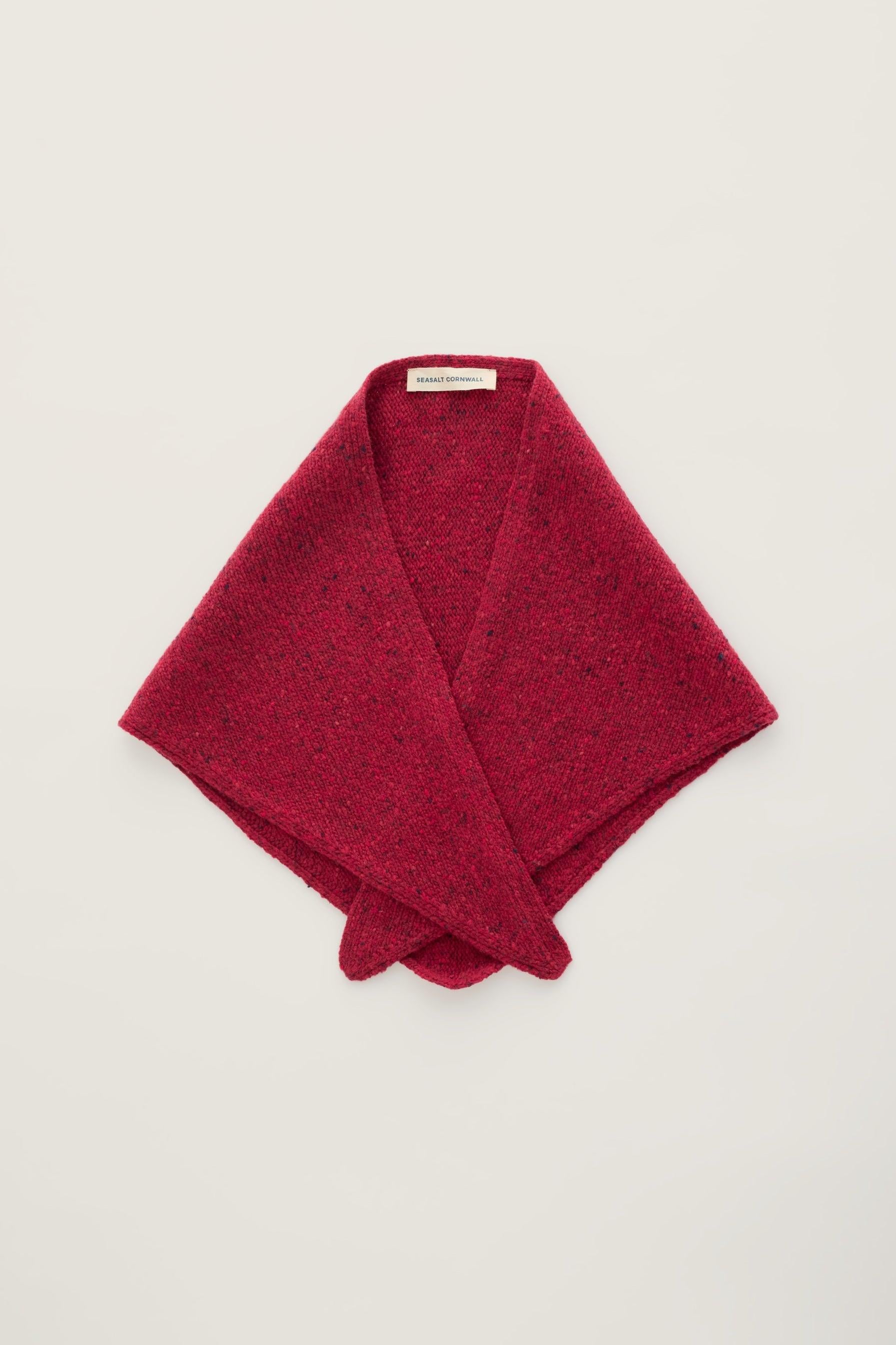 A pink Seasalt Cornwall wool scarf folded against a plain light background.