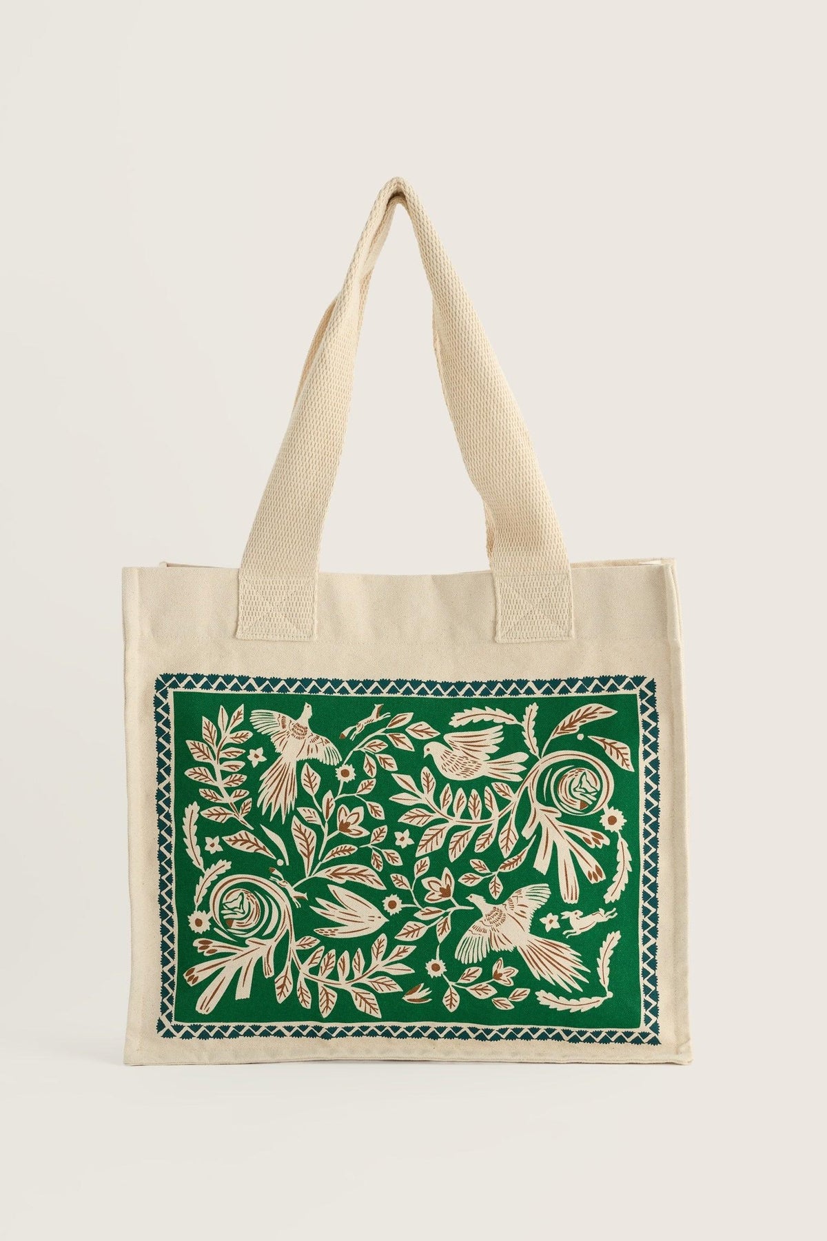 Seasalt Cornwall canvas shopping bag featuring a green and cream bird and botanical folk art print.