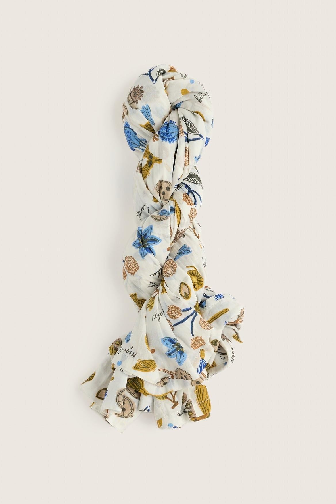 Seasalt Cornwall cotton scarf with blue and gold floral botanical print on white background