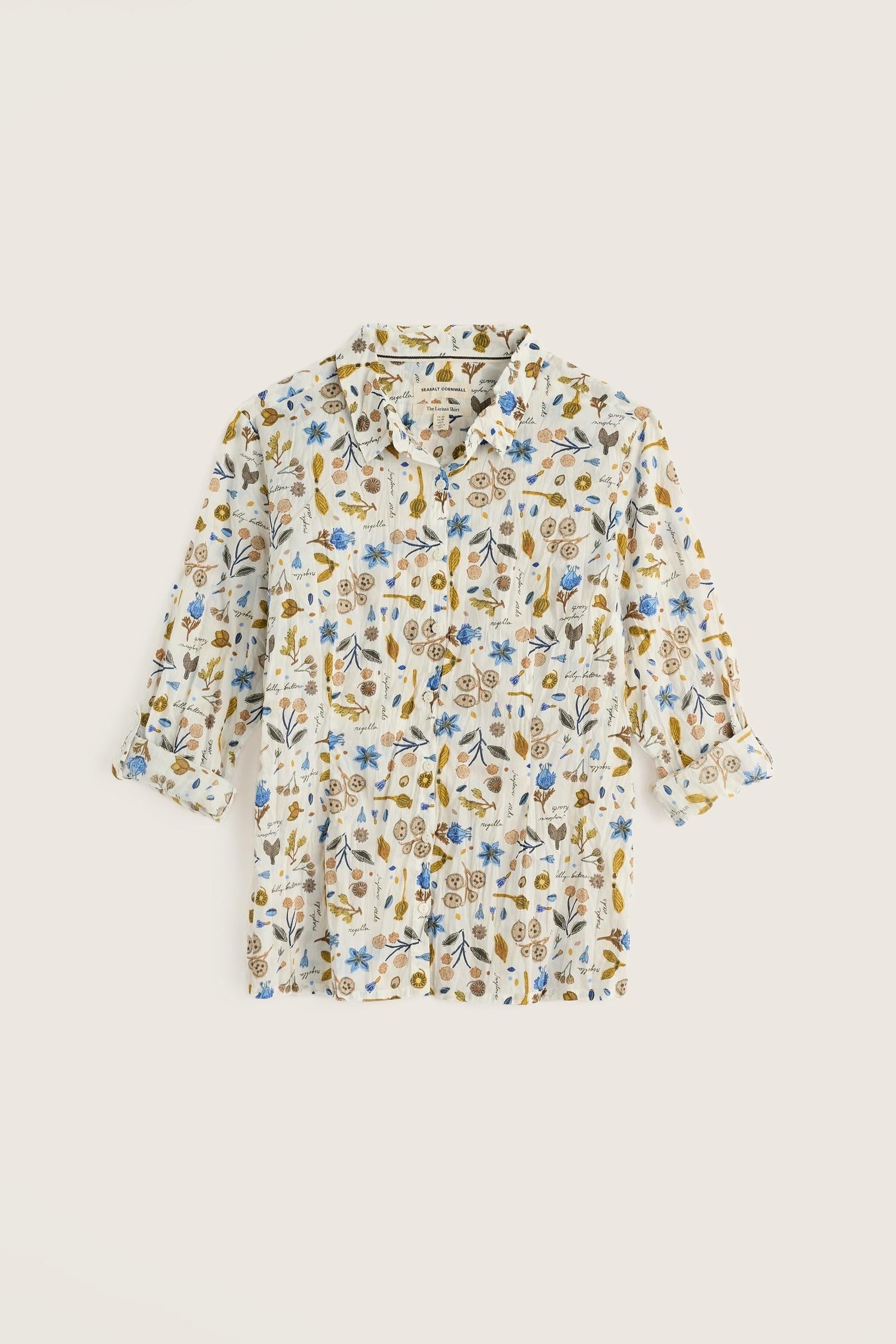 A Seasalt Cornwall women's shirt in white cotton featuring a delicate blue and gold botanical print.