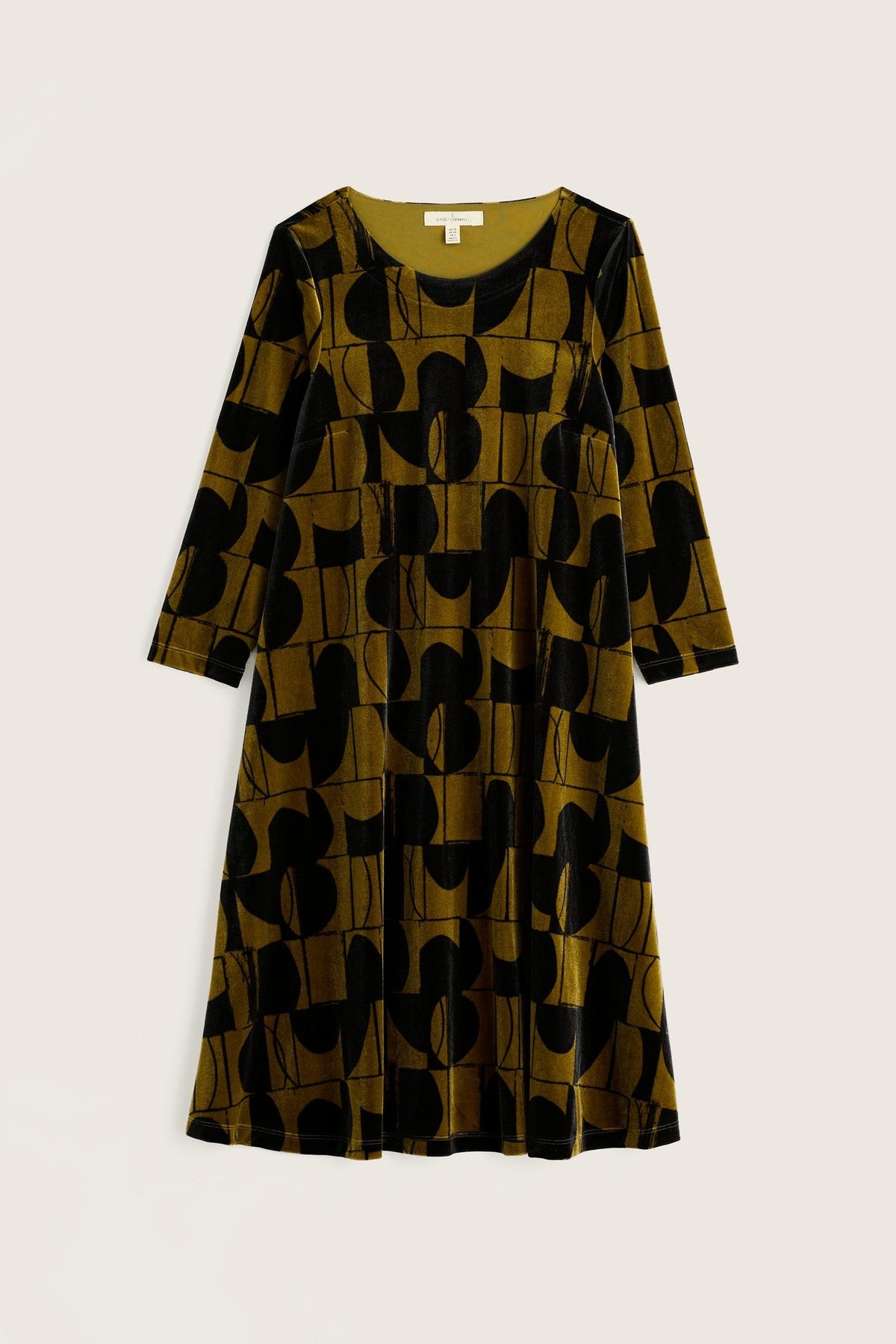 Seasalt Cornwall olive and black geometric print velvet winter party dress on a plain background.