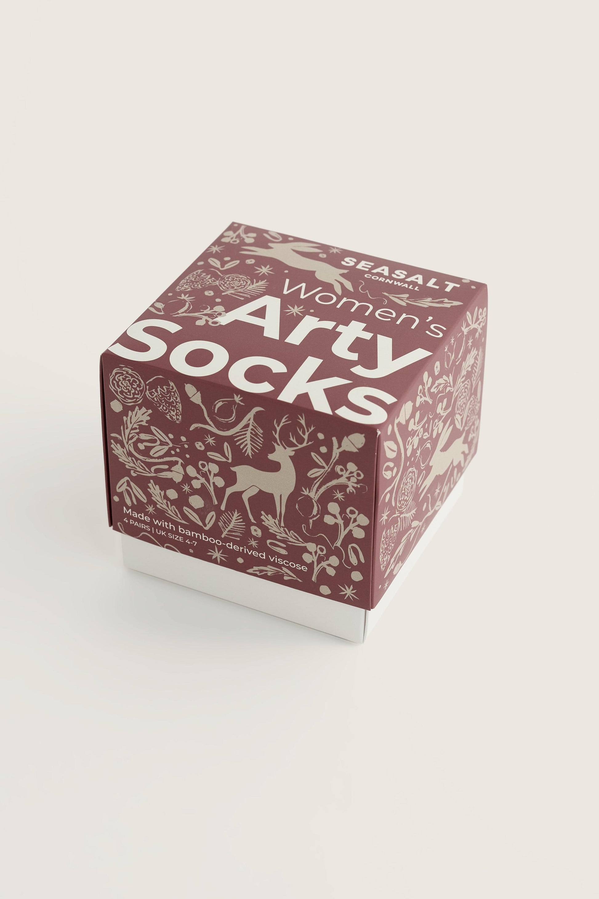 Seasalt Cornwall gift box containing women's bamboo socks with woodland-themed holiday illustrations.