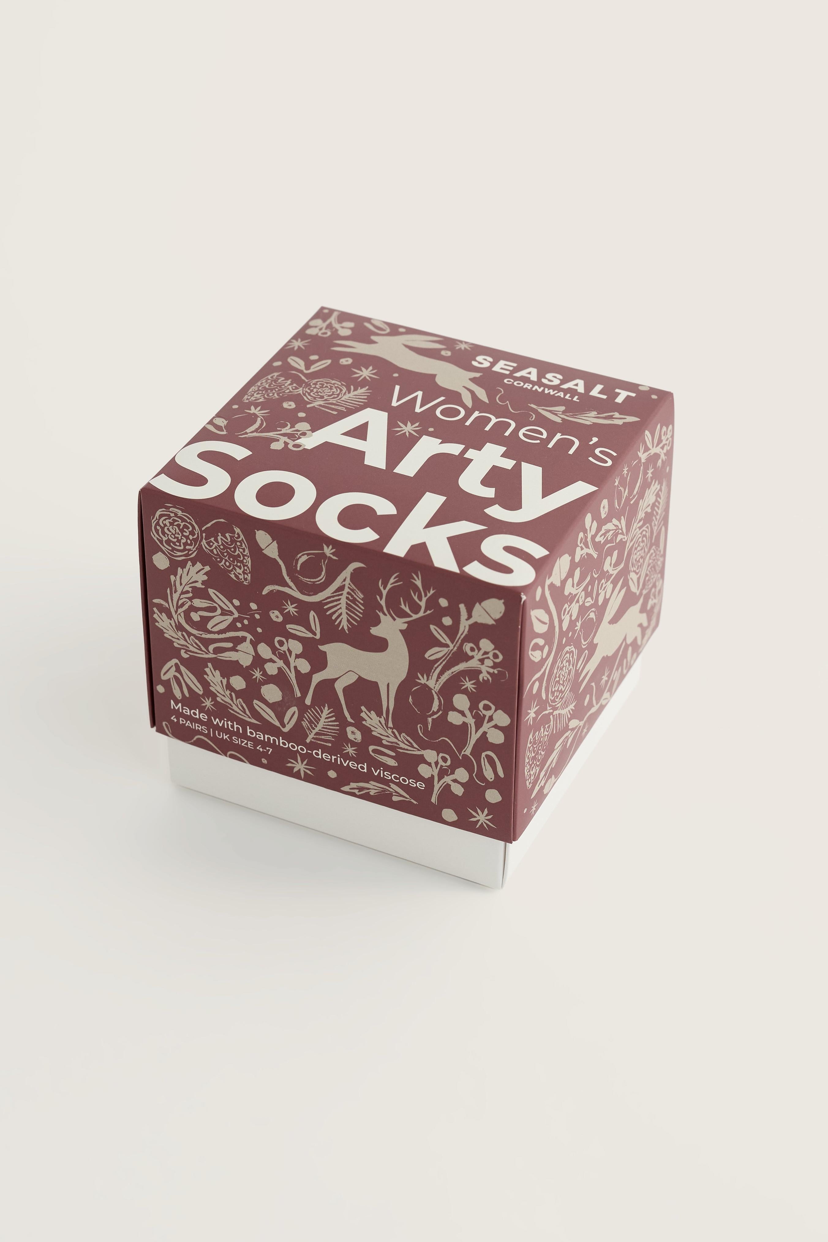 Seasalt Cornwall gift box containing women's bamboo socks with woodland-themed holiday illustrations.
