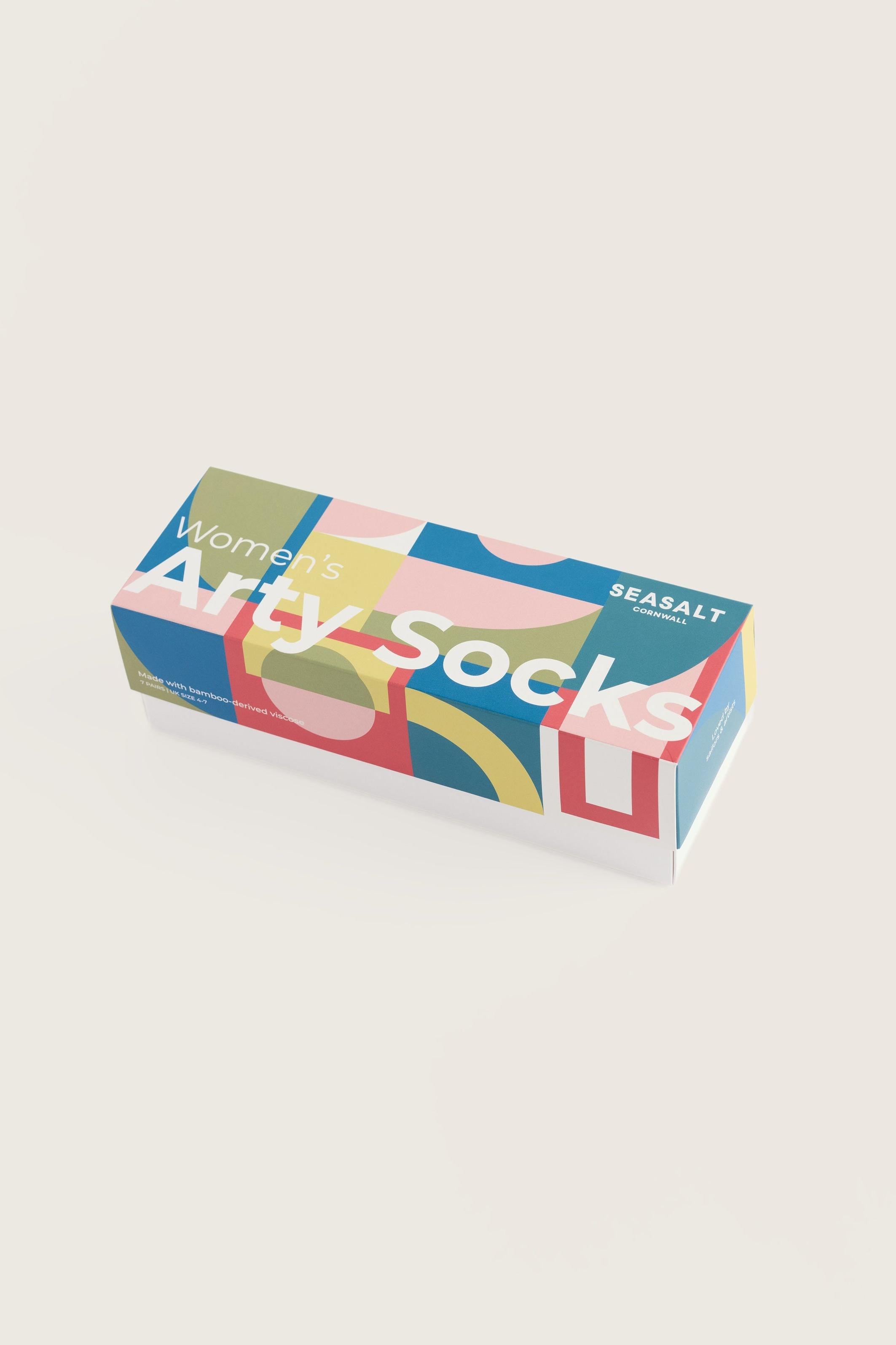 Seasalt Cornwall Women’s Arty Socks giftbox with colorful geometric patterns against a plain background.