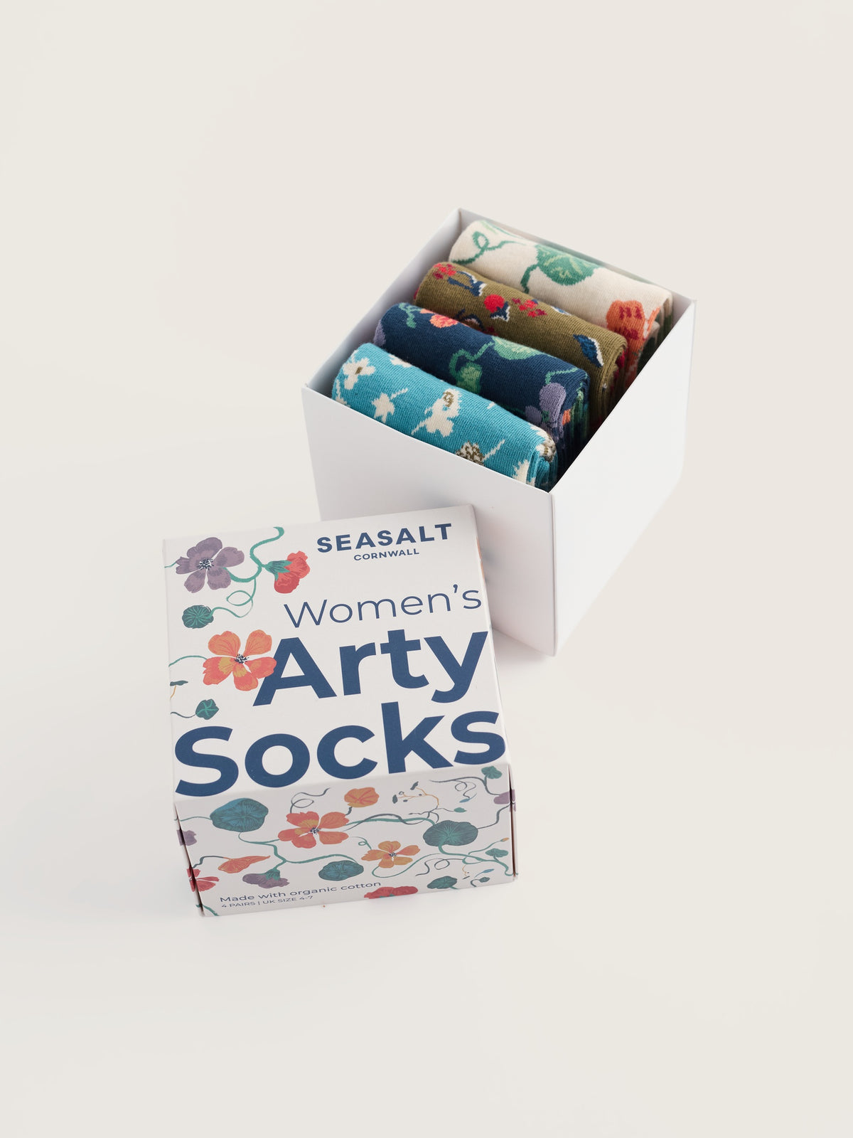 A Seasalt Cornwall gift box containing four pairs of floral print women's cotton socks.