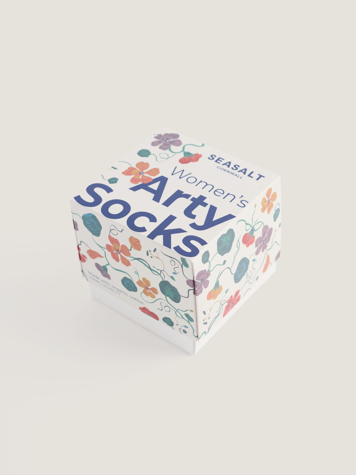 A square gift box for Seasalt Cornwall women's cotton socks with a floral pattern on a plain background.