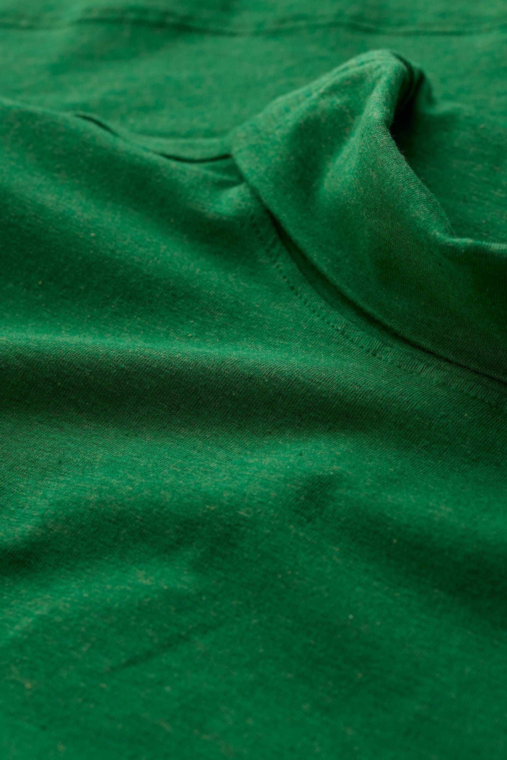 Close-up of the Seasalt Landing Top fabric in Hedgerow showing the soft, breathable organic cotton texture.