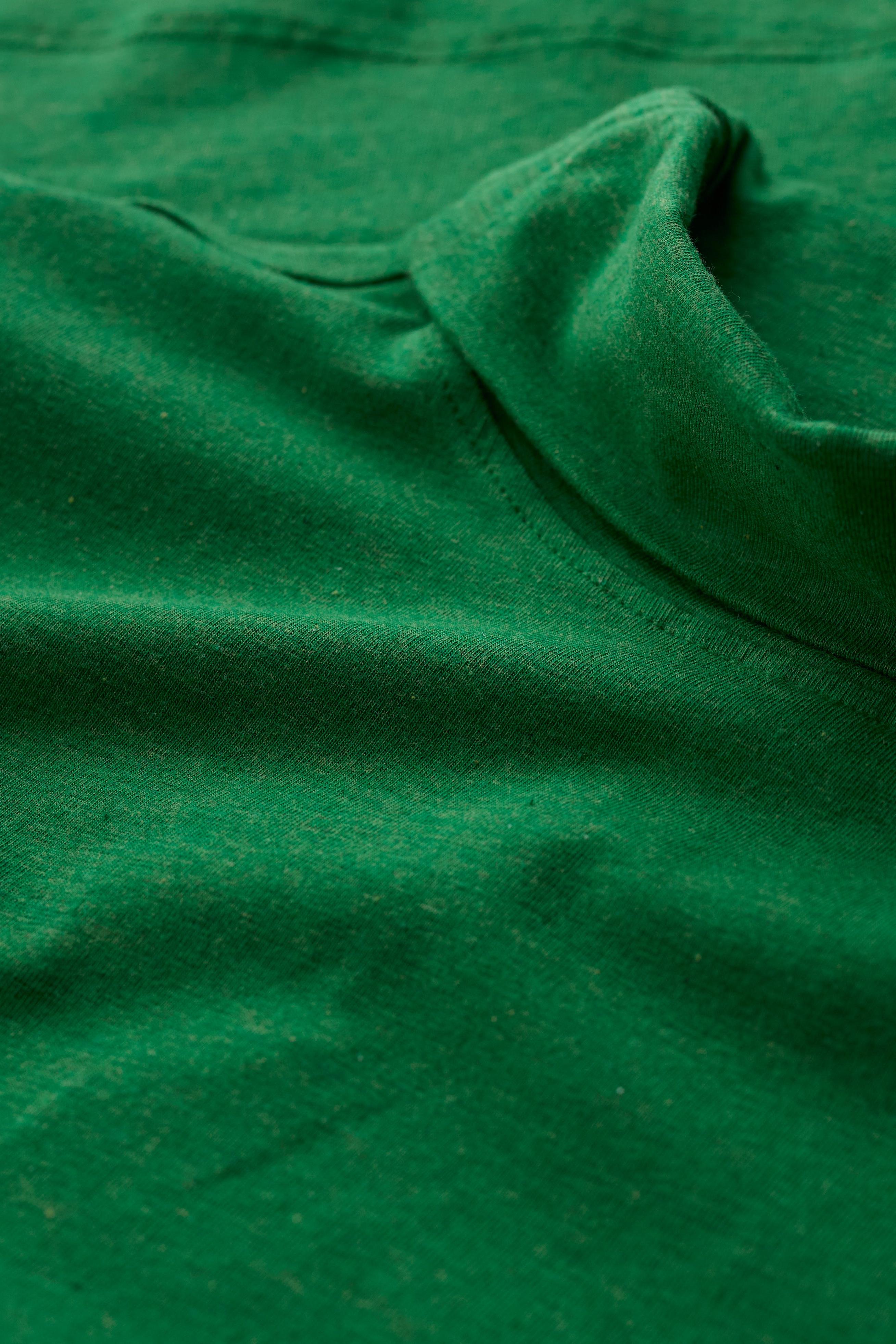 Close-up of the Seasalt Landing Top fabric in Hedgerow showing the soft, breathable organic cotton texture.