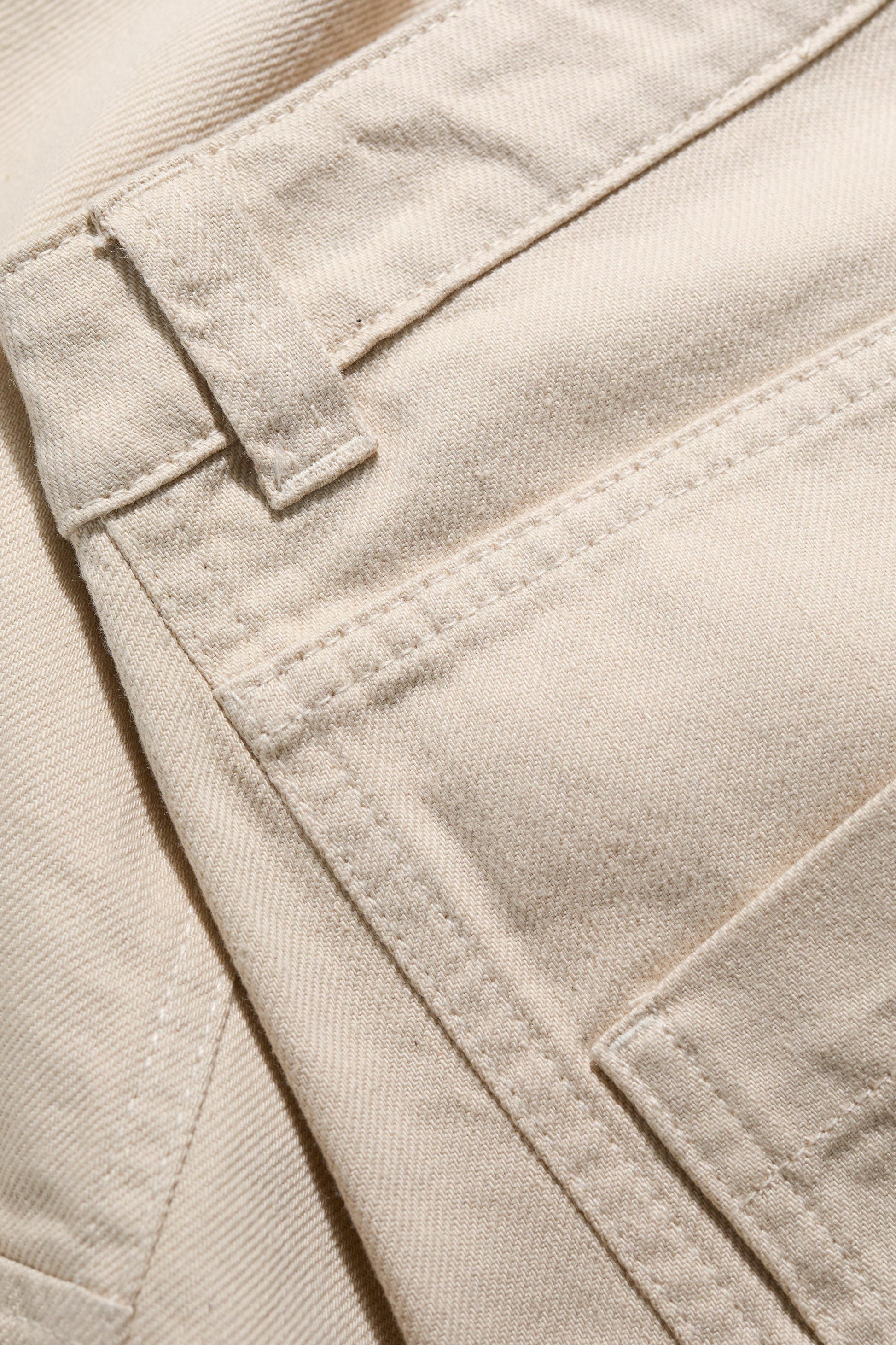 Close-up of beige fabric with stitching details