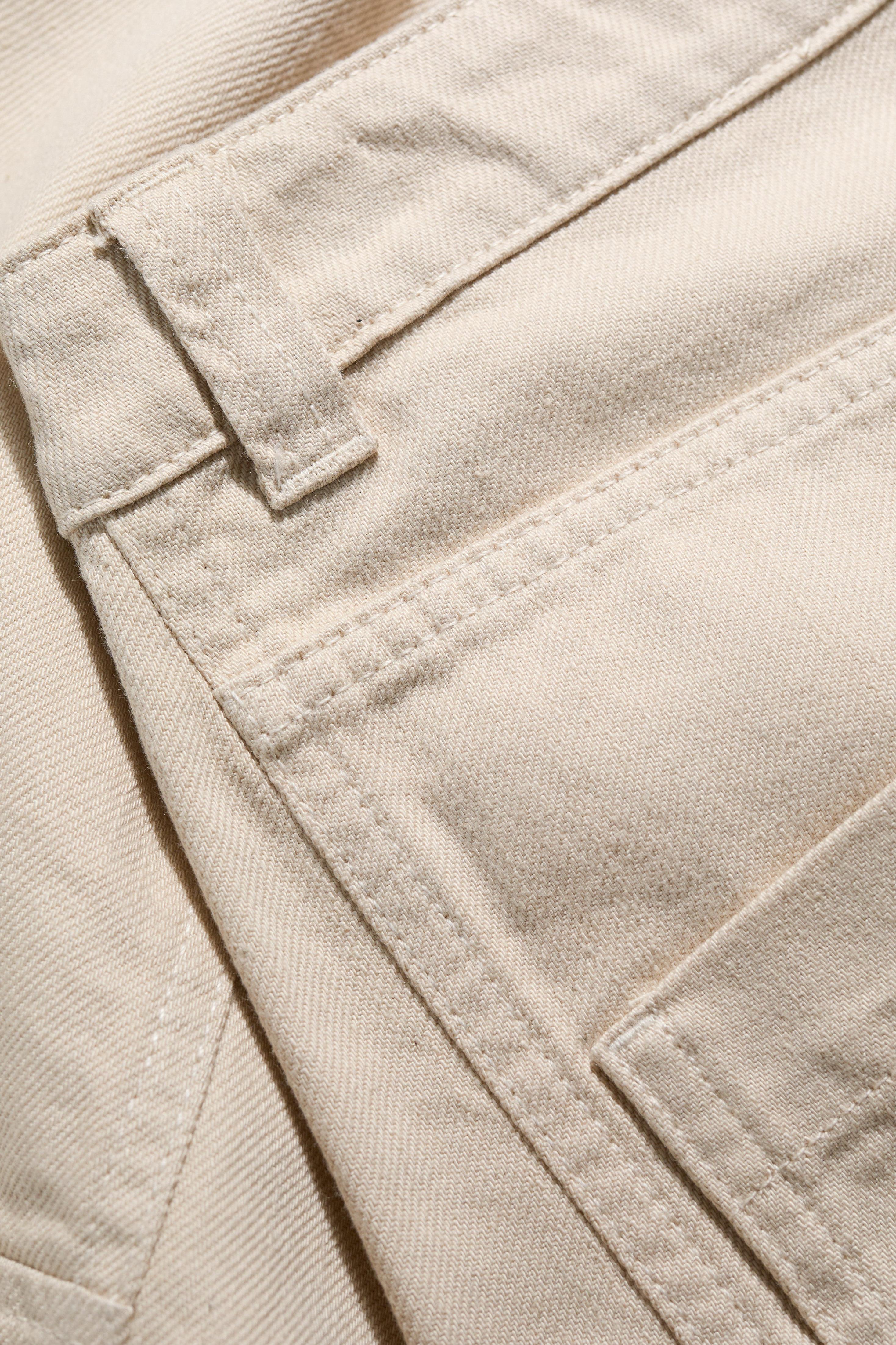 Close-up of beige fabric with stitching details