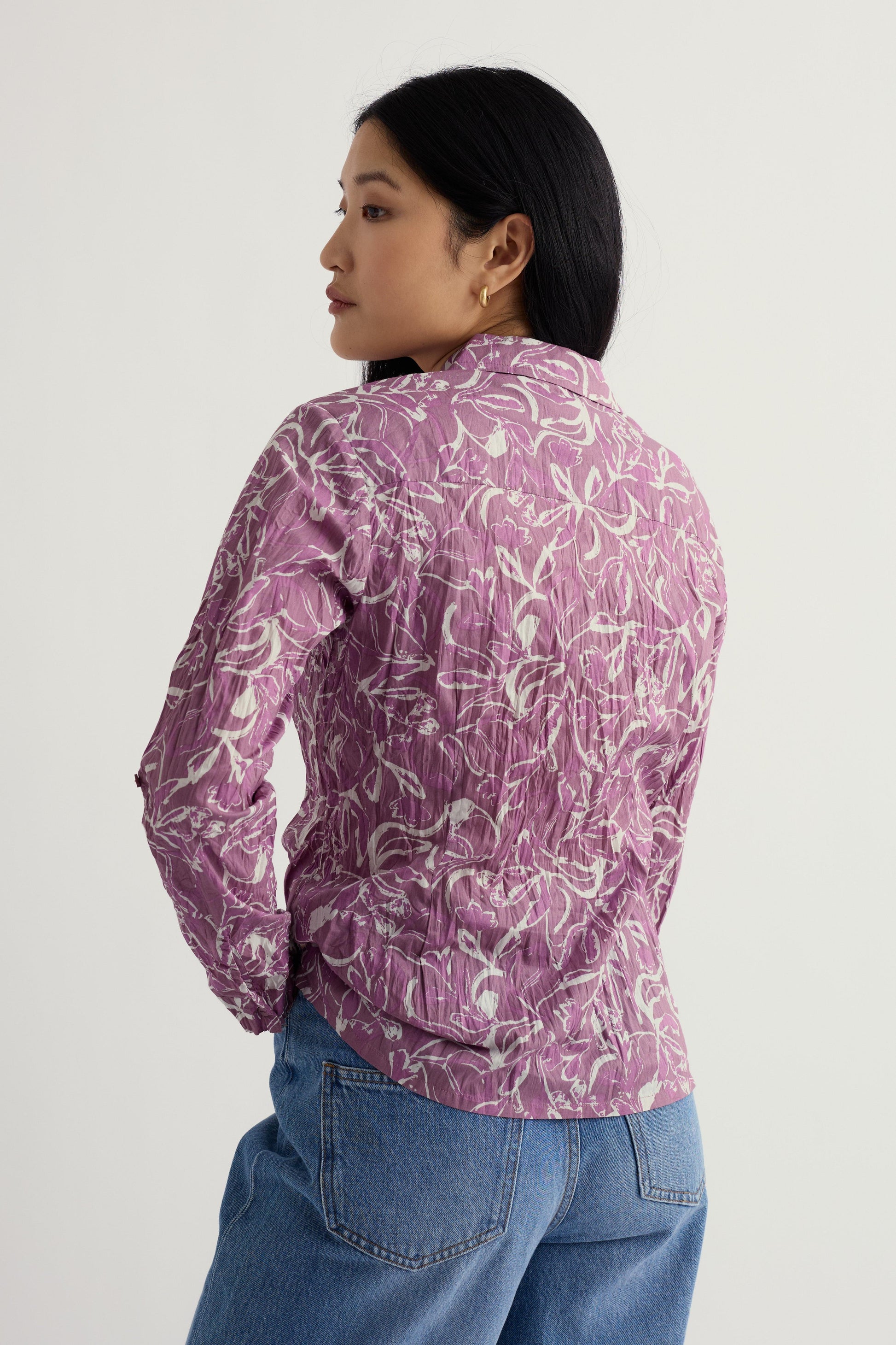 Person wearing a Seasalt Larissa shirt on a plain background