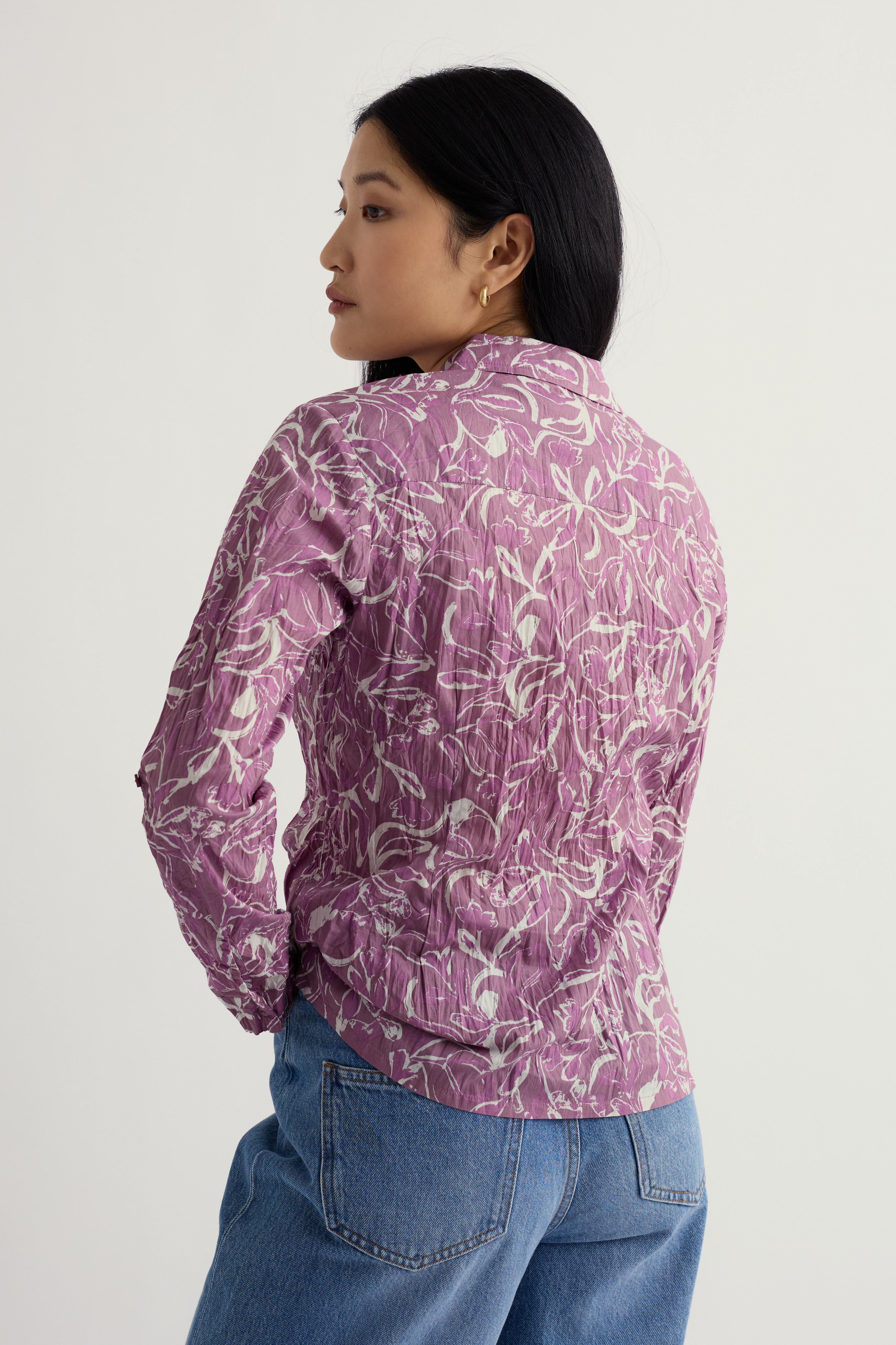 Person wearing a Seasalt Larissa shirt on a plain background