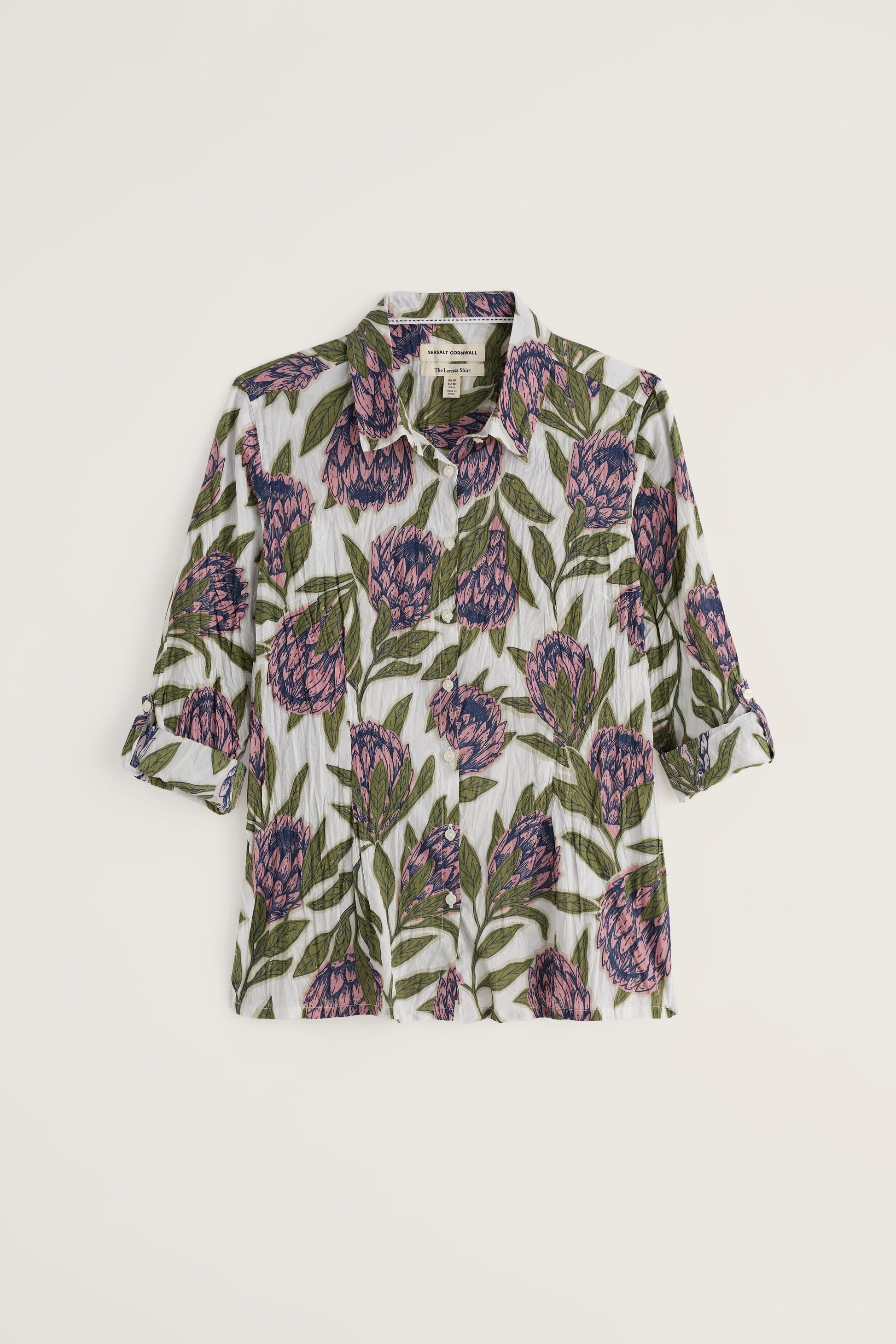 Floral patterned shirt on a light beige background