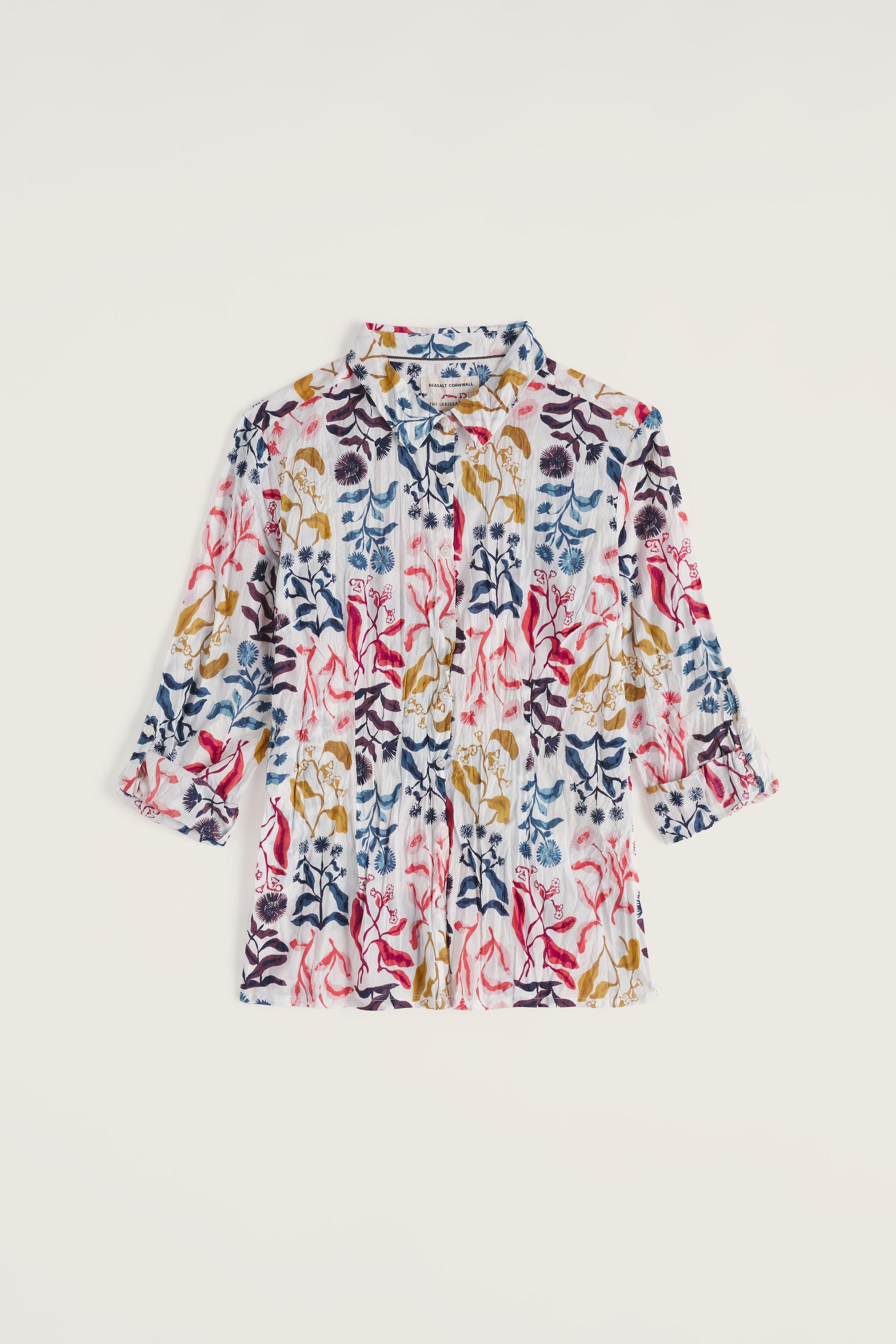 Floral-patterned organic cotton shirt on a beige background