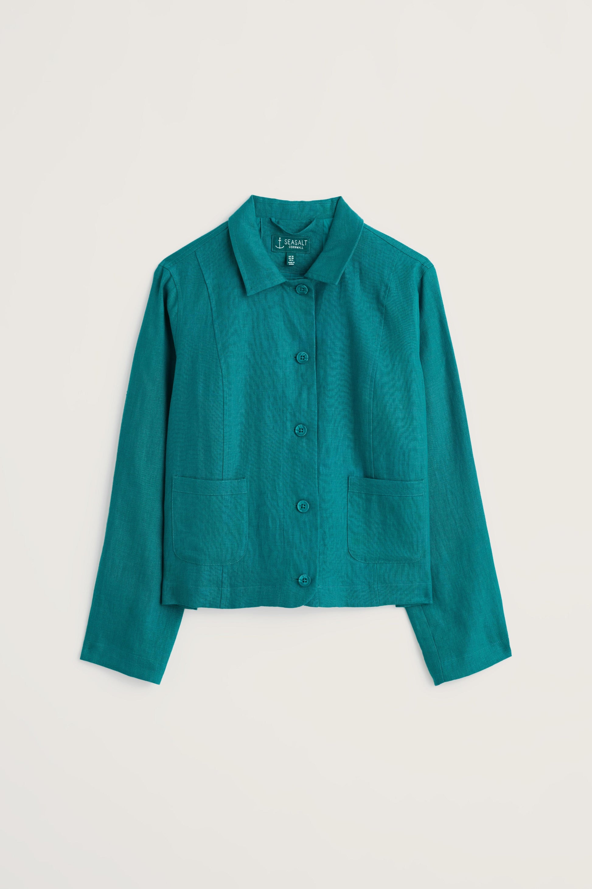 Teal linen jacket on a light beige background