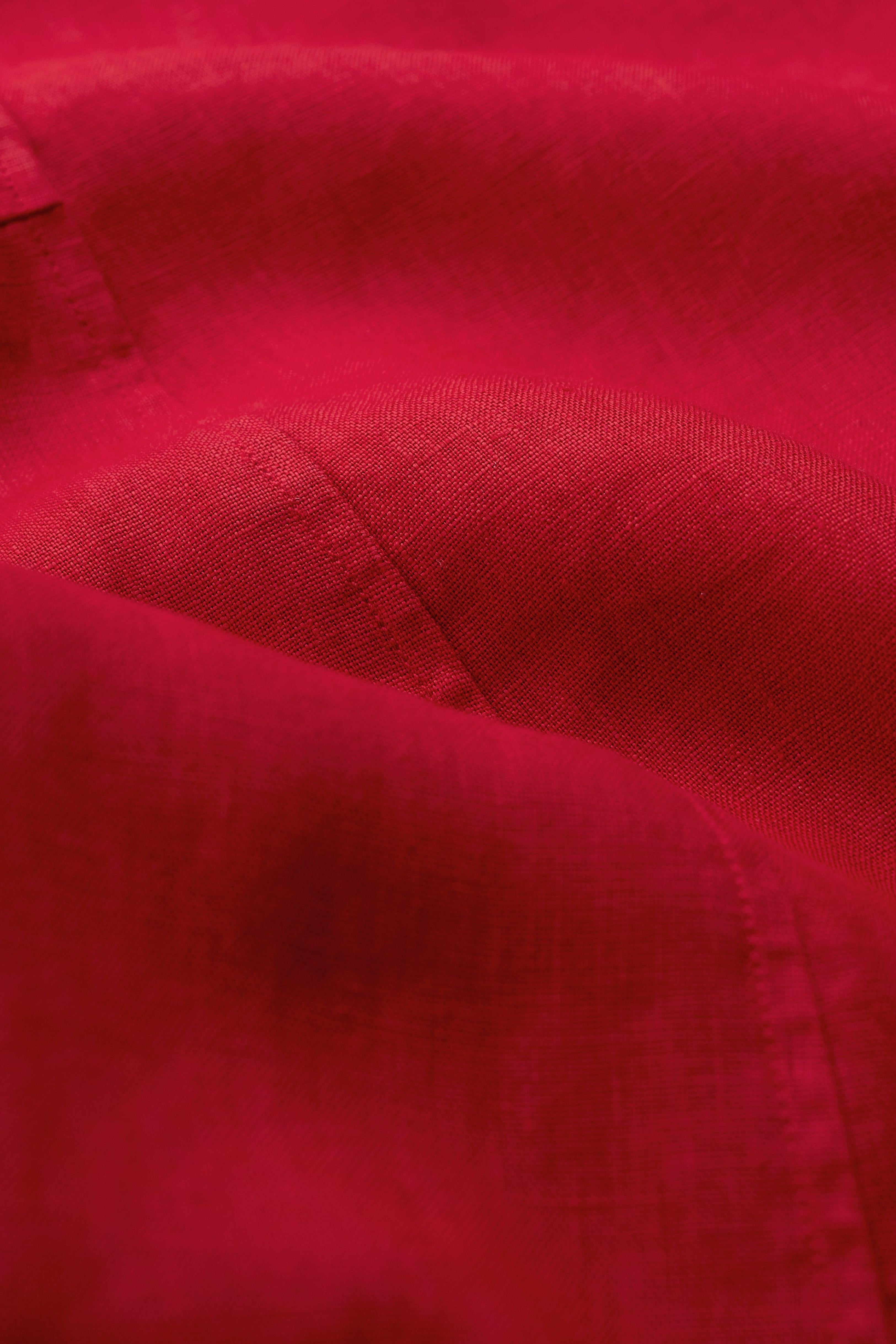 Close-up of red linen midi dress fabric