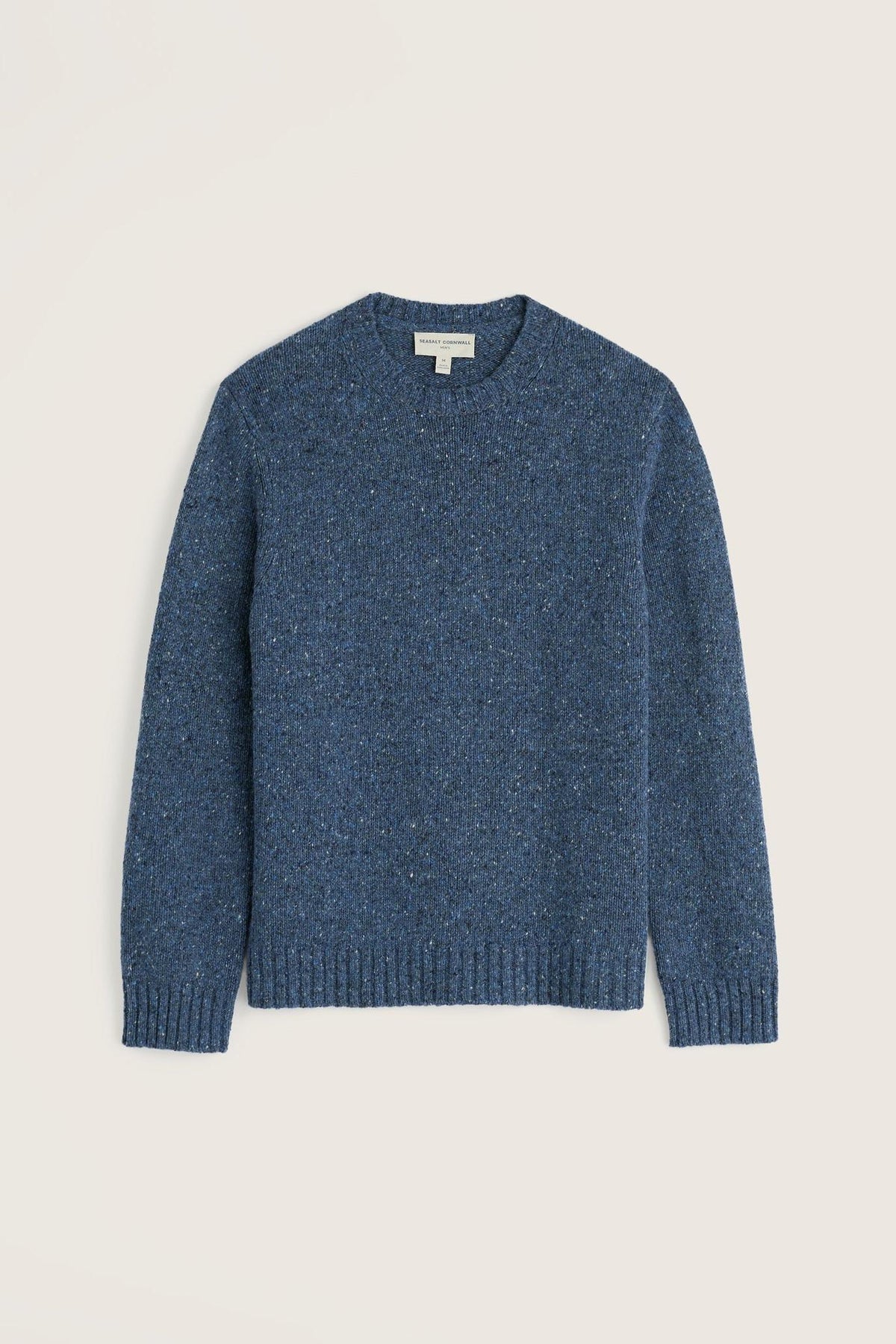 A Seasalt blue knit jumper made from wool with a crew neck, displayed against a light background.